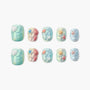 Handmade ocean-themed press-on nails with 3D seashell and starfish designs in pastel colors