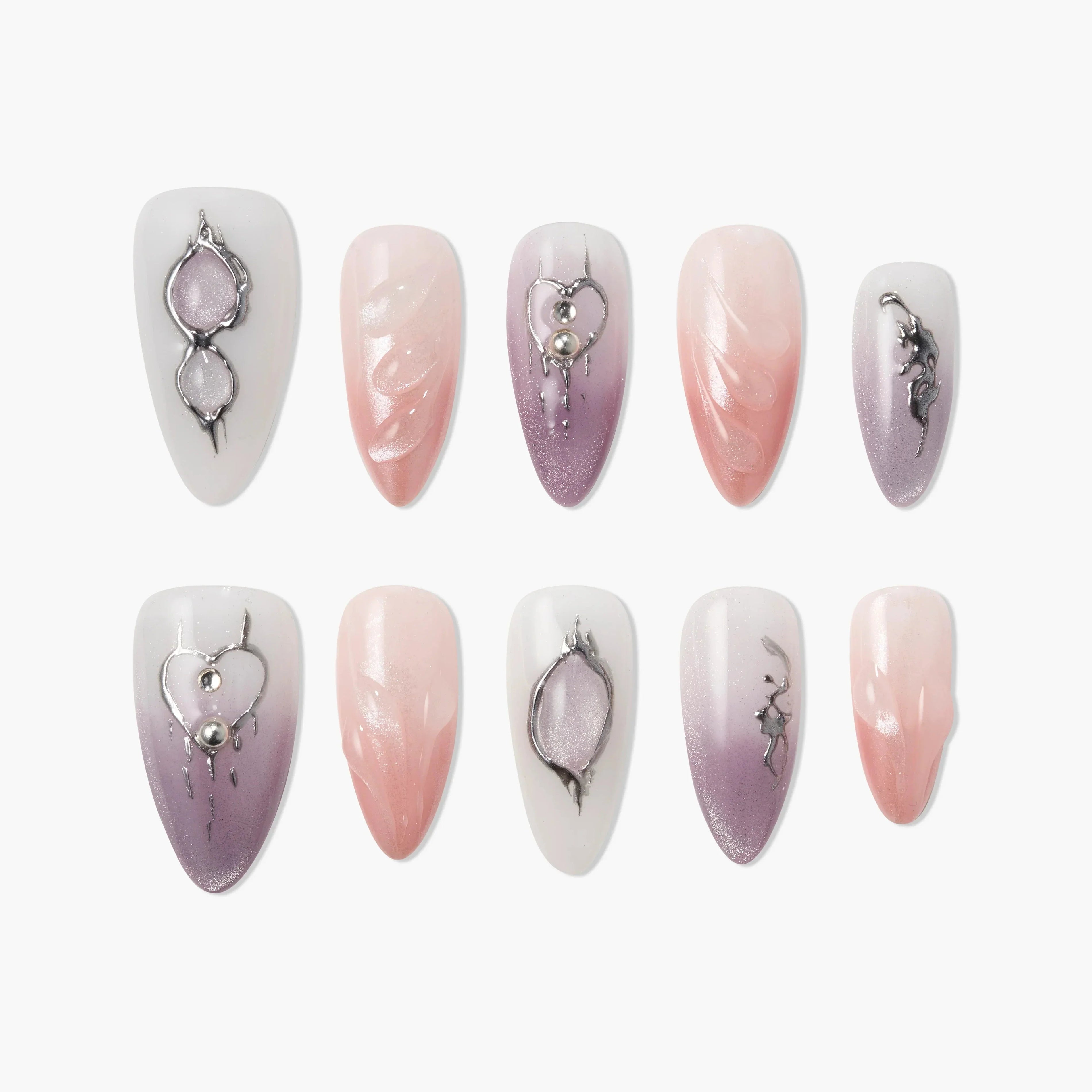 Set of handmade press-on nails in pink, lavender, and white with 3D metallic accents