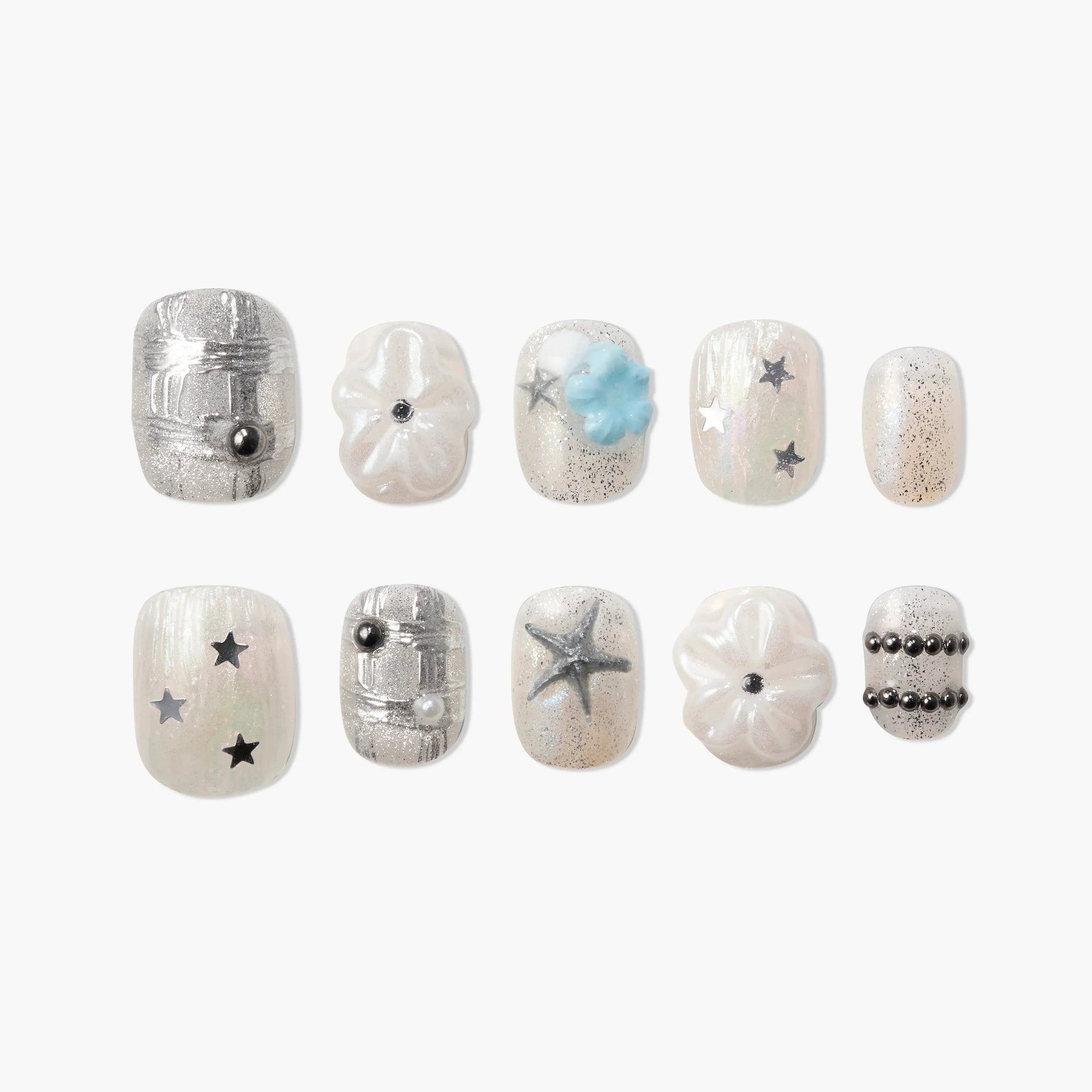 Handmade press-on nails with pearl and silver accents, 3D flower, star, and bead designs