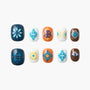 Handmade press-on nails with blue, orange, and white floral and geometric designs