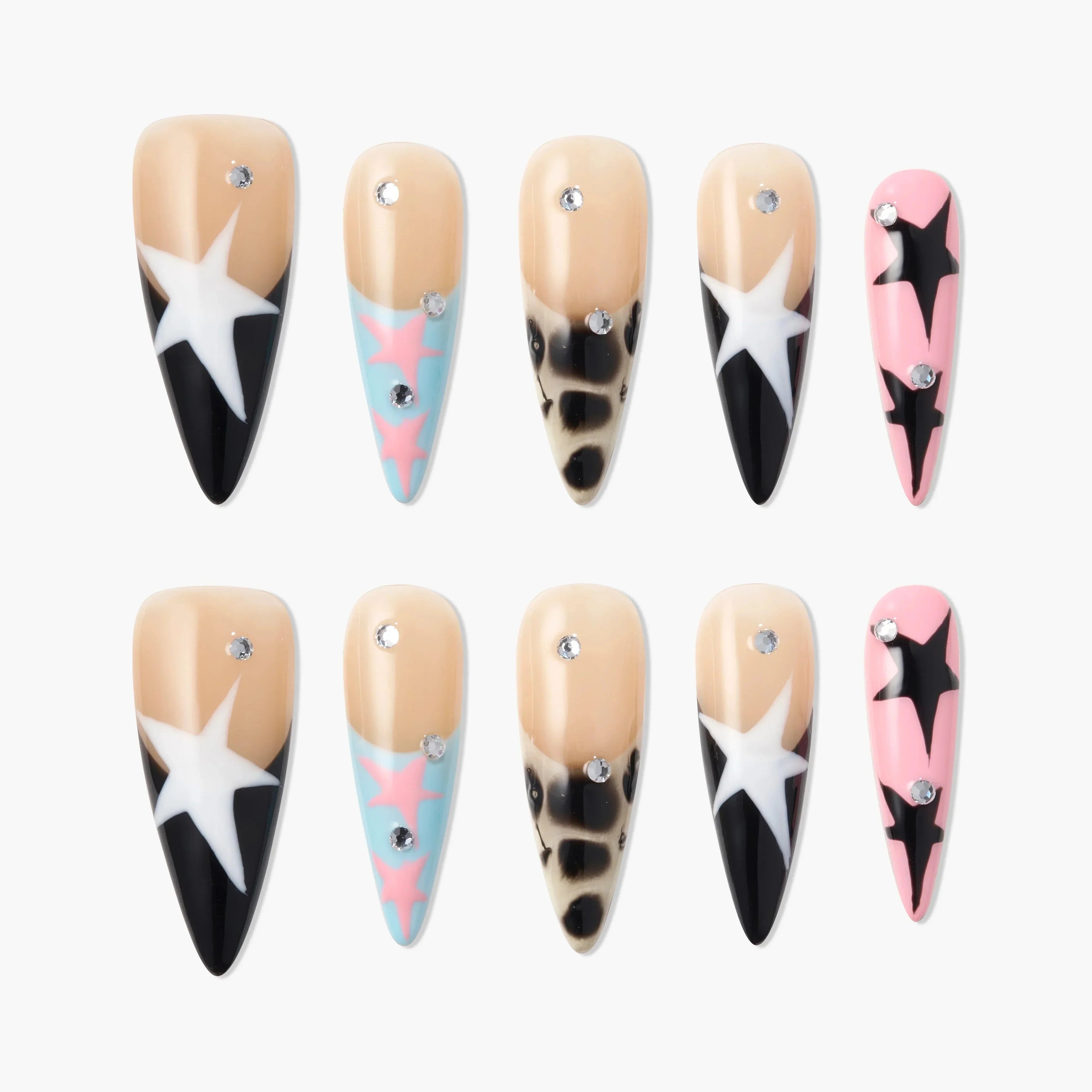 Handmade press-on nails with star, leopard, rhinestone, and pastel designs on a white background