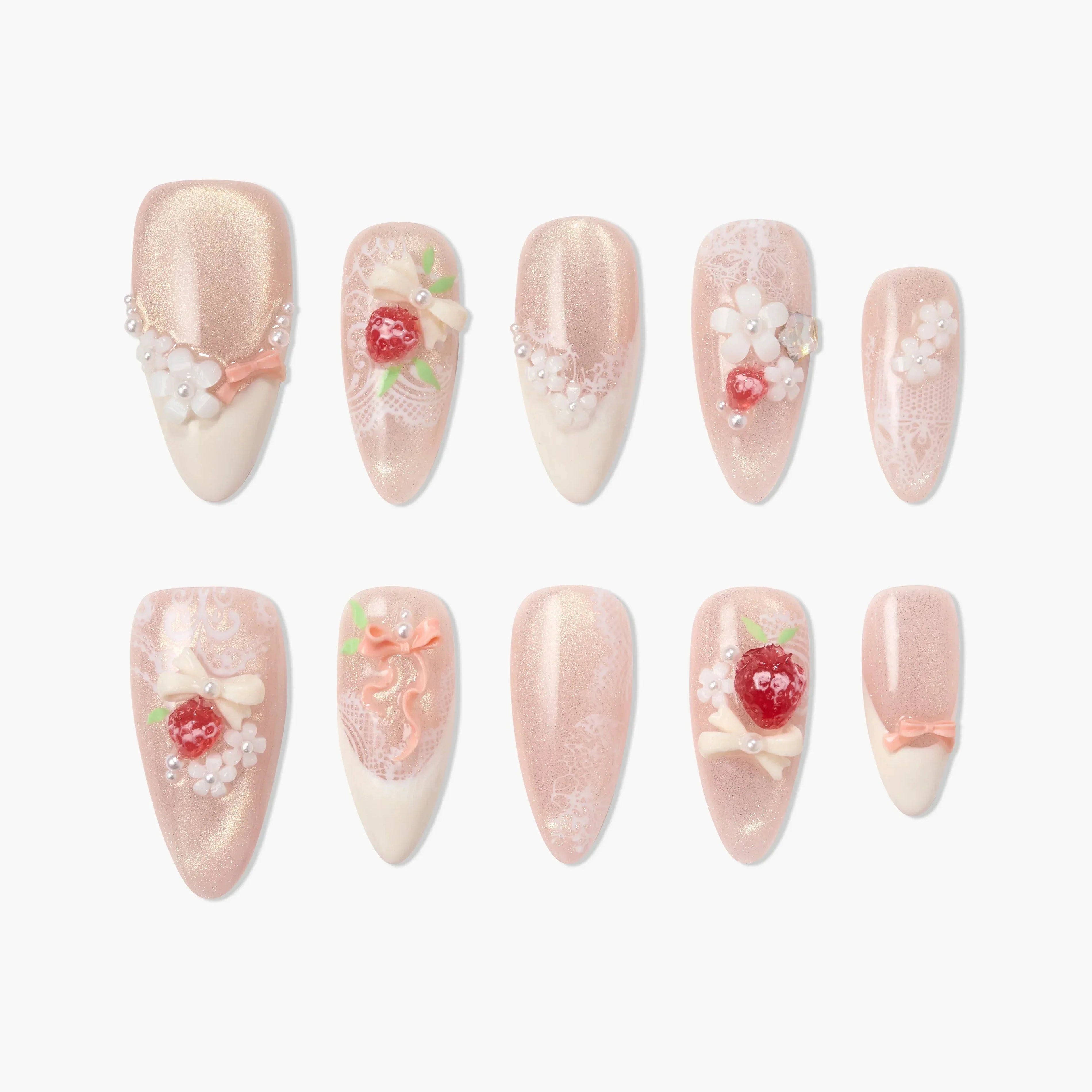 Handmade pink press-on nails with 3D floral, bow, and berry designs, pearl accents, and lace details.