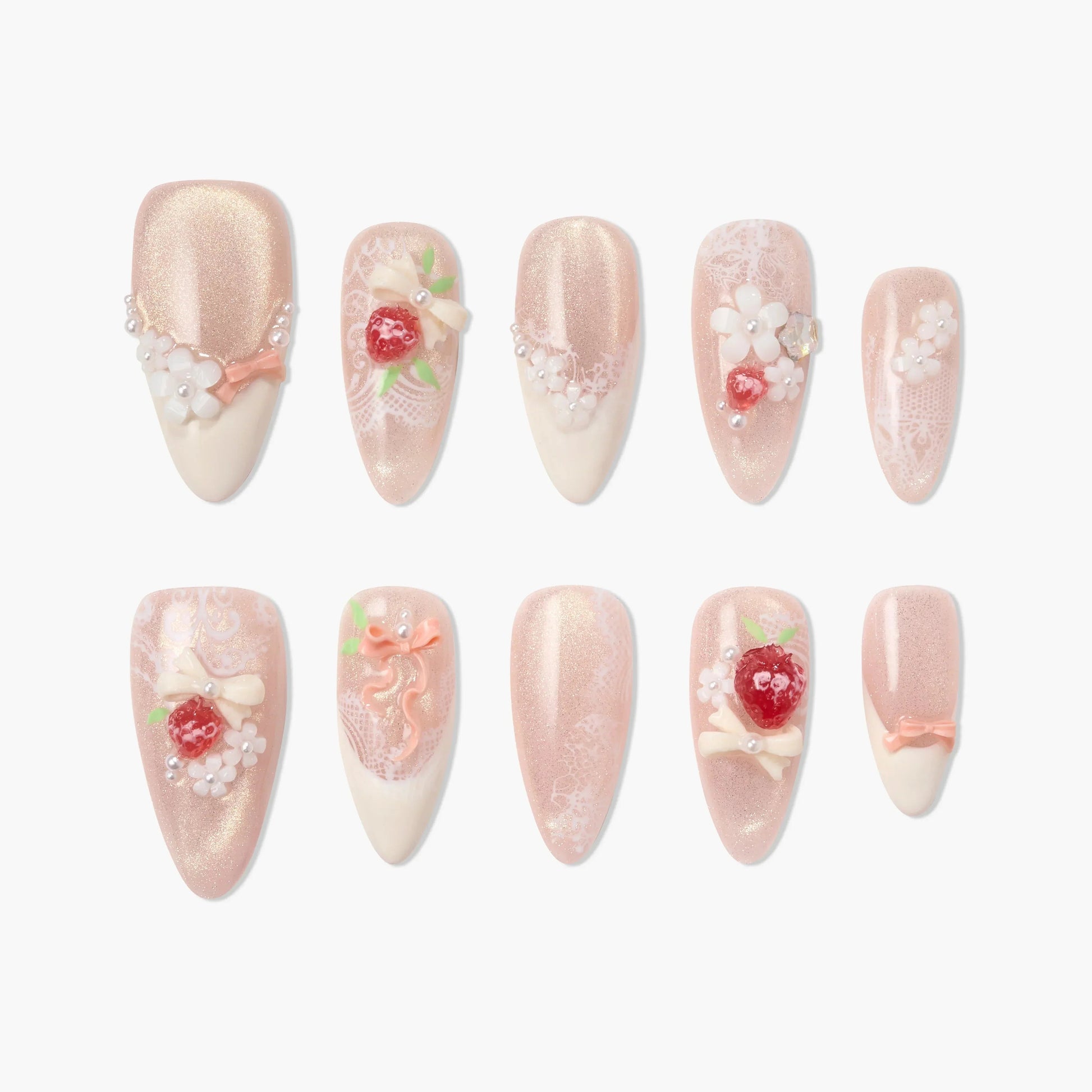 Handmade pink press-on nails with 3D floral, bow, and berry designs, pearl accents, and lace details.