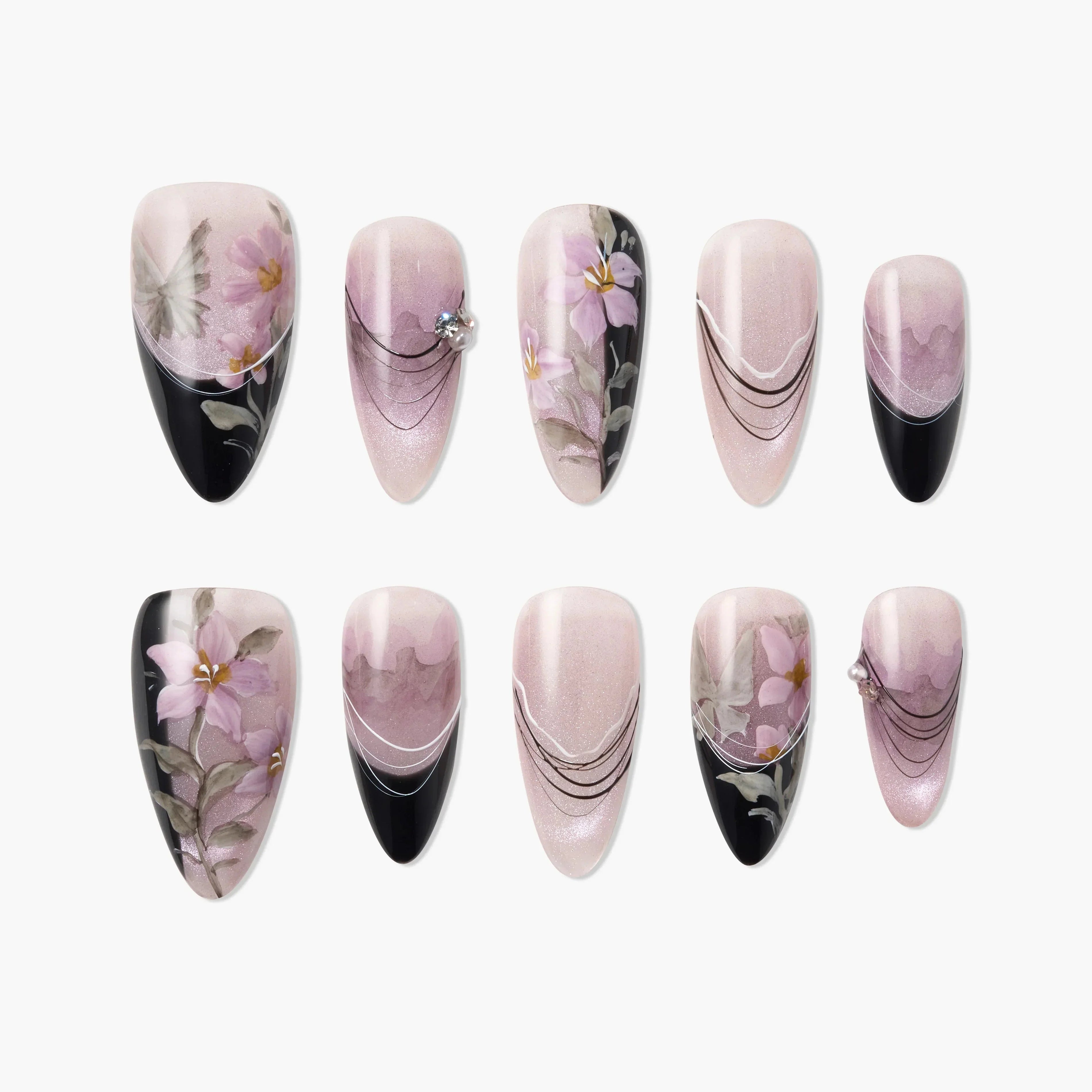Handmade press-on nails with pink floral designs, black tips, and rhinestone accents
