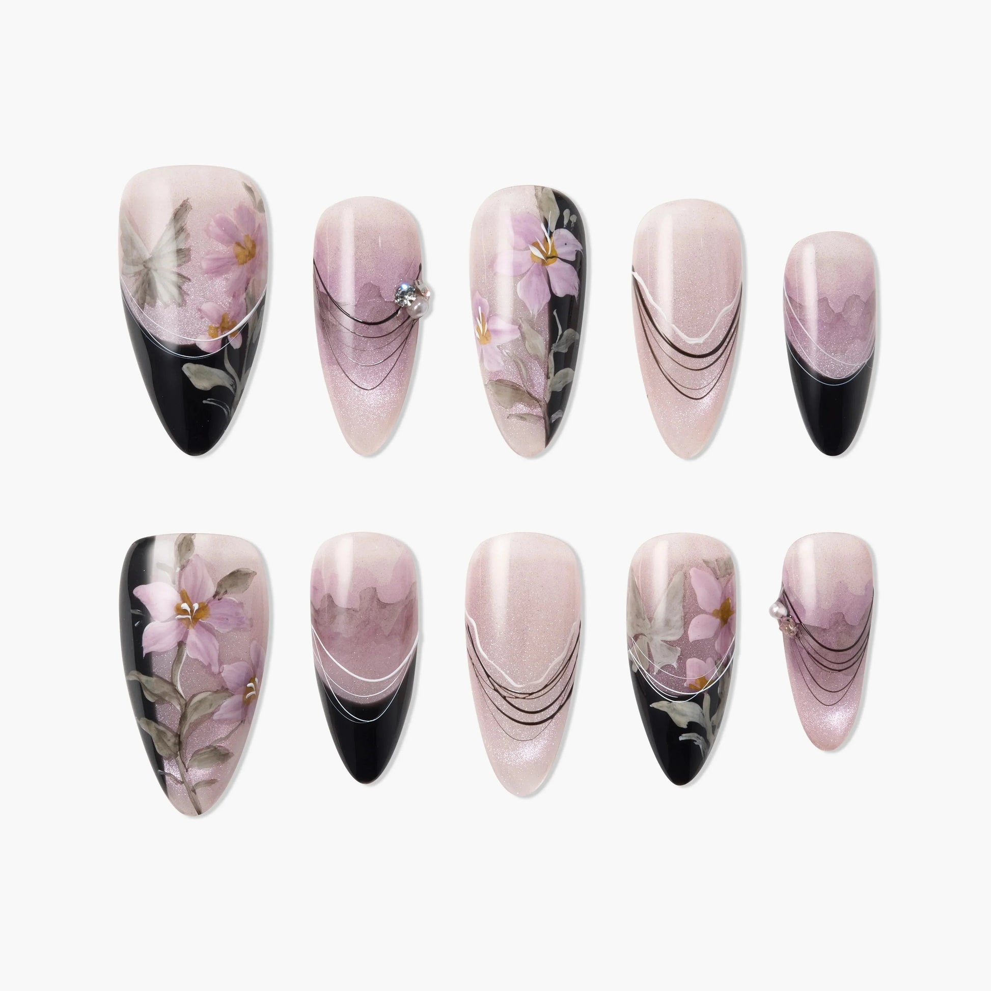 Handmade press-on nails with pink floral designs, black tips, and rhinestone accents