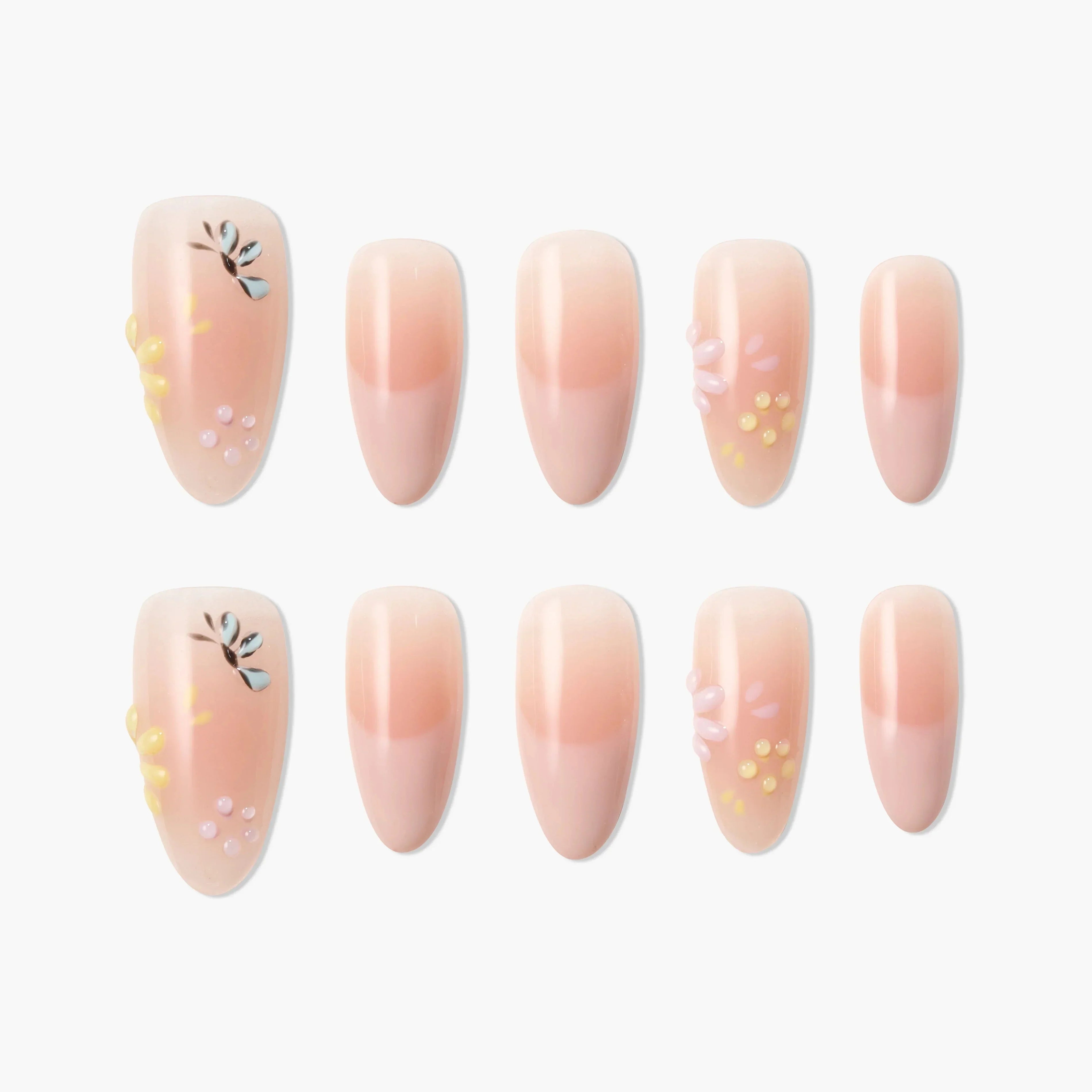 Handmade press-on nails with pink ombre, floral accents, and 3D flower designs