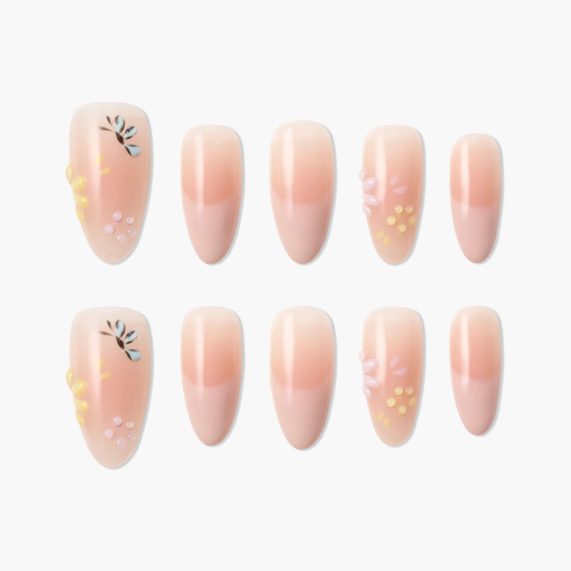 Handmade press-on nails with pink ombre, floral accents, and 3D flower designs