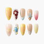 Handmade press-on nails with floral, butterfly, and abstract 3D designs in pastel colors
