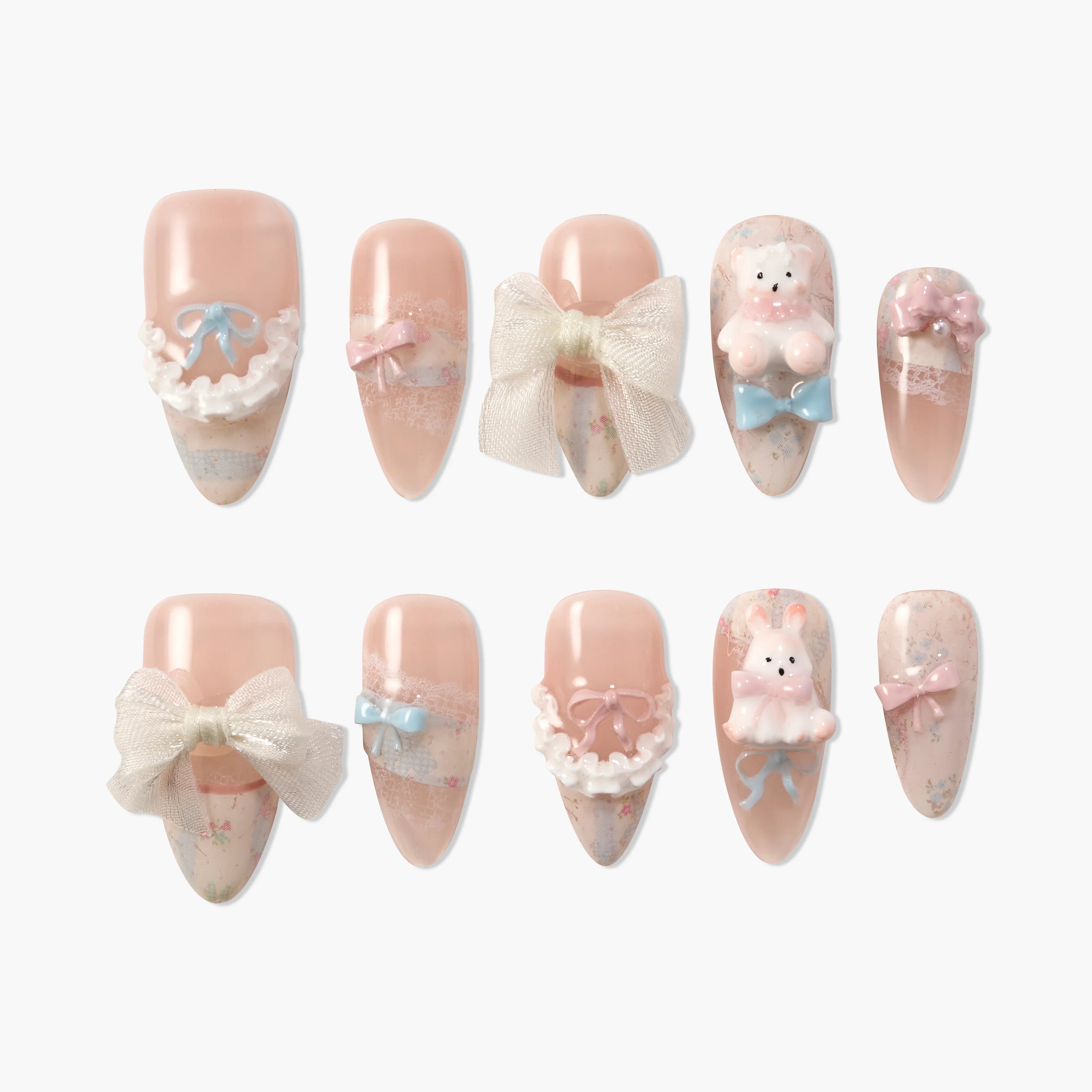Cute handmade press-on nails in soft pink with bows, lace, 3D bear and bunny accents.