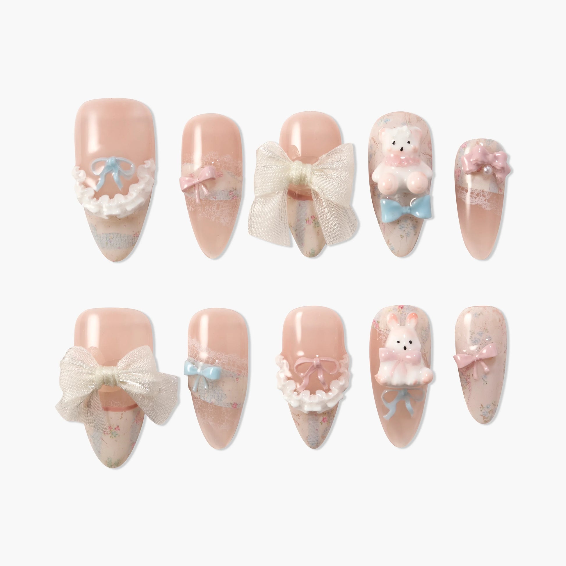 Cute handmade press-on nails in soft pink with bows, lace, 3D bear and bunny accents.