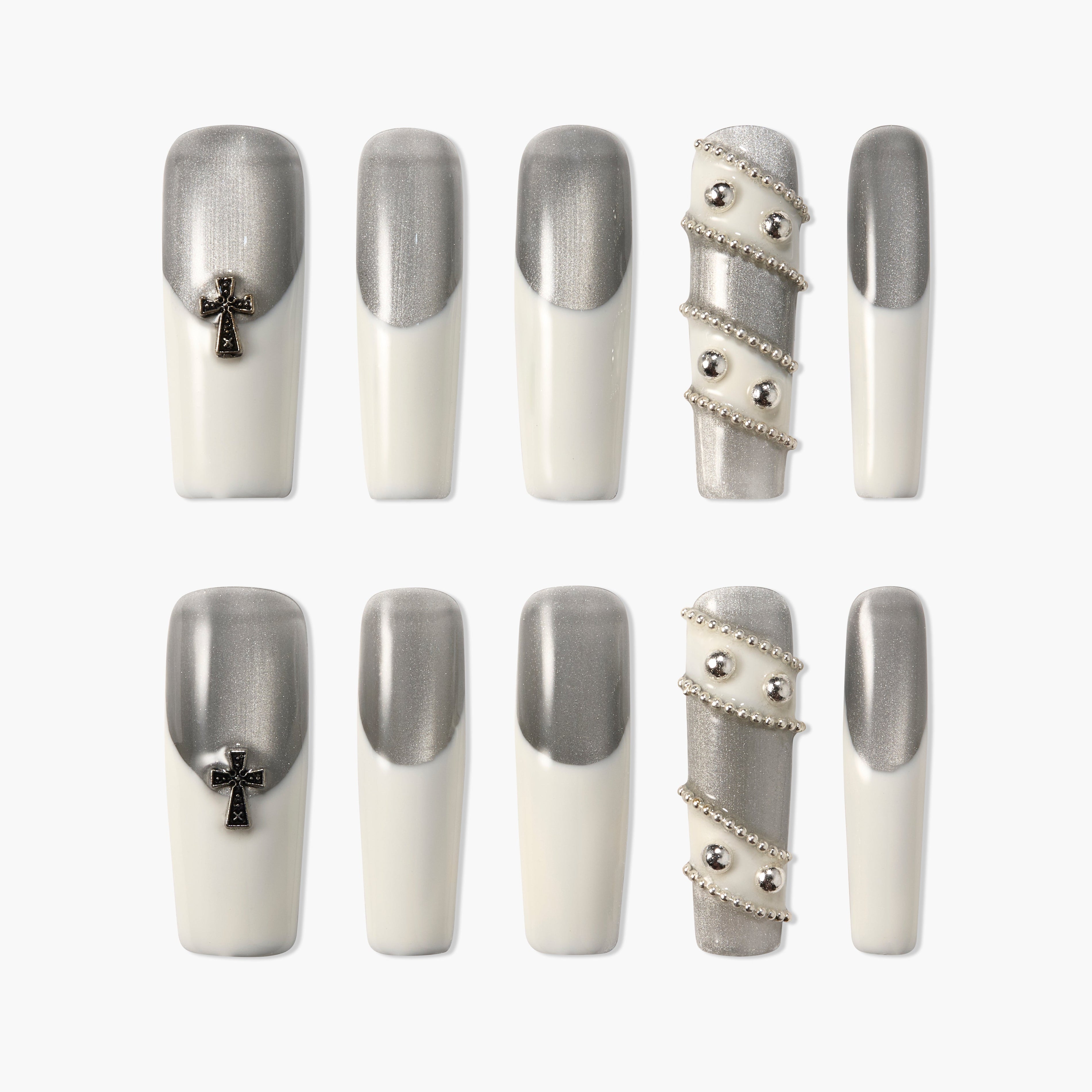 Handmade silver and white press-on nails with cross charms and metallic bead accents