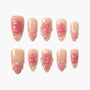 Handmade press-on nails with pink floral 3D designs, pearls, and rhinestone accents