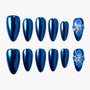 Glossy blue press-on nails with 3D blue flower accent and pearl embellishments