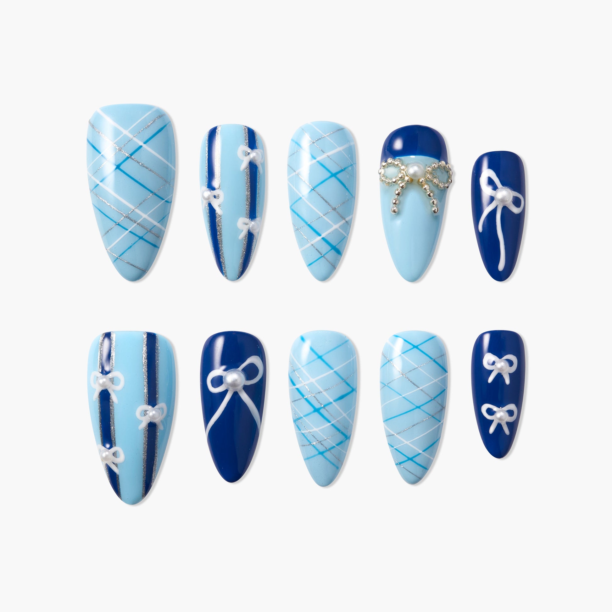 Blue press-on nails with plaid, bow, and pearl accents in various elegant designs