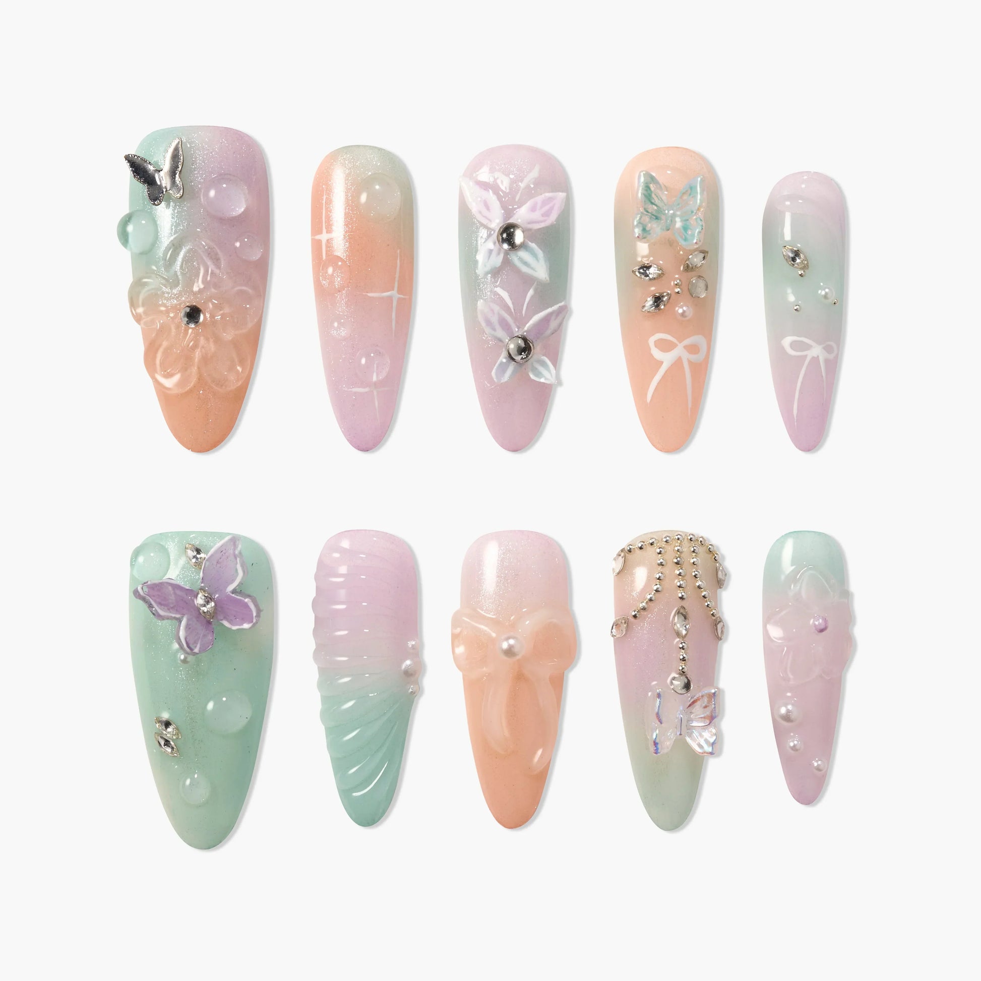Handmade pastel press-on nails with butterfly, flower, bow, and gem 3D designs
