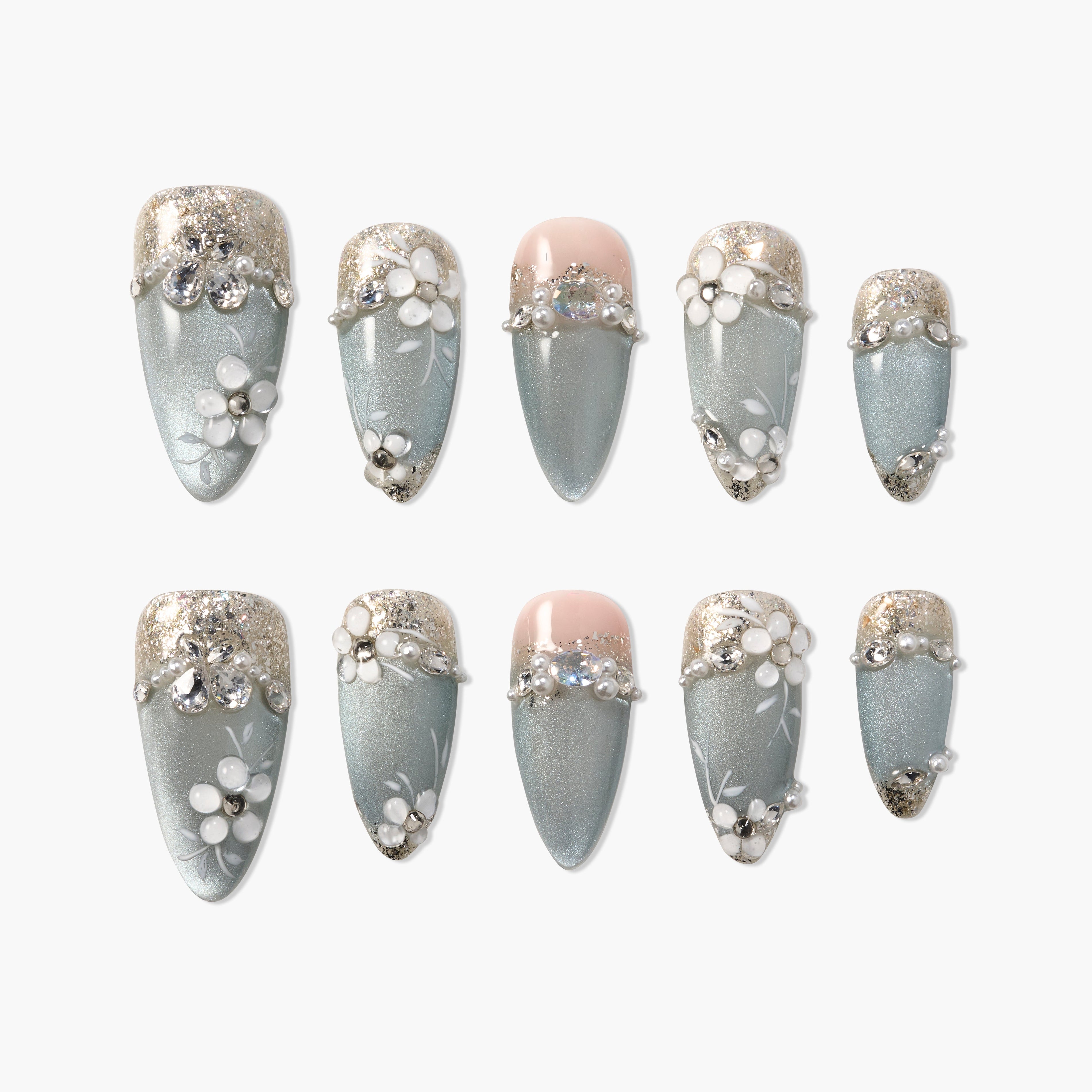 Handmade press-on nails with metallic light blue base, 3D floral designs, rhinestones, and glitter tips.
