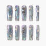Holographic blue press-on nails with 3D star and gemstone celestial designs