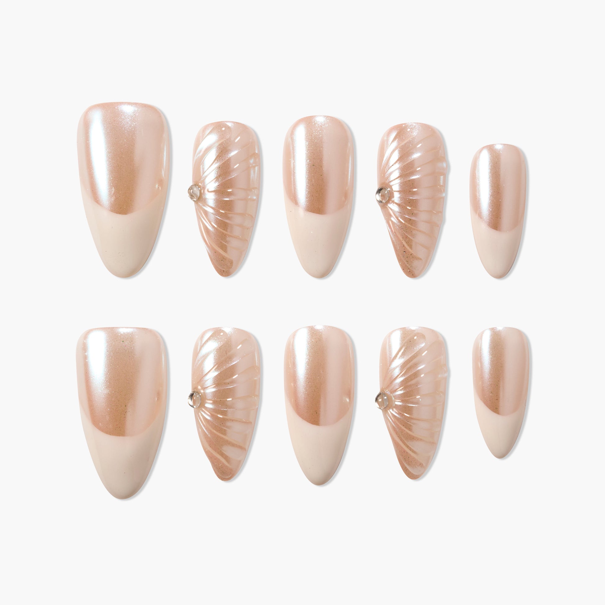 Pearl nude press-on nails set with shell-inspired accents and small gem details, on white background