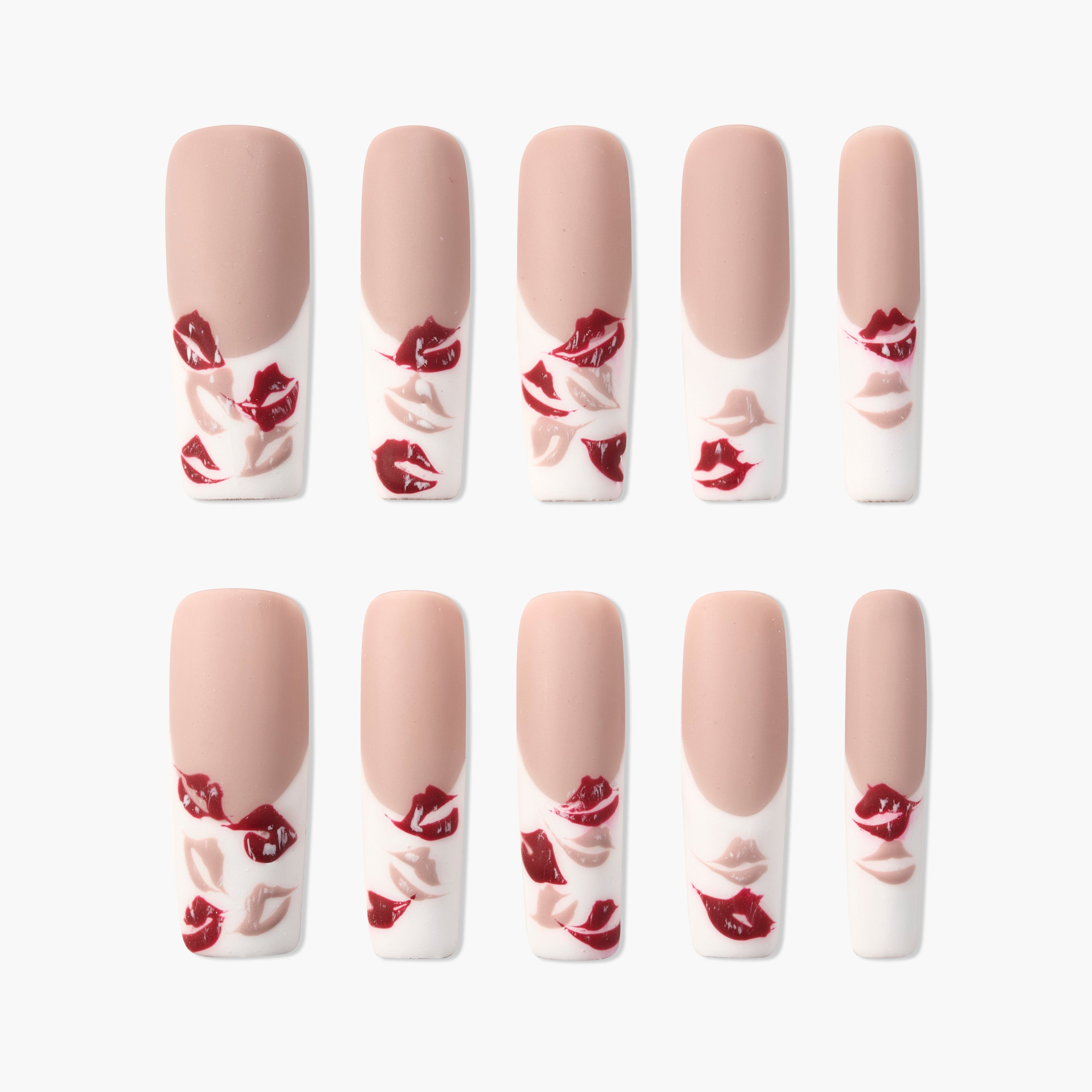 Handmade nude and white press-on nails with red and pink lip print designs, glossy finish