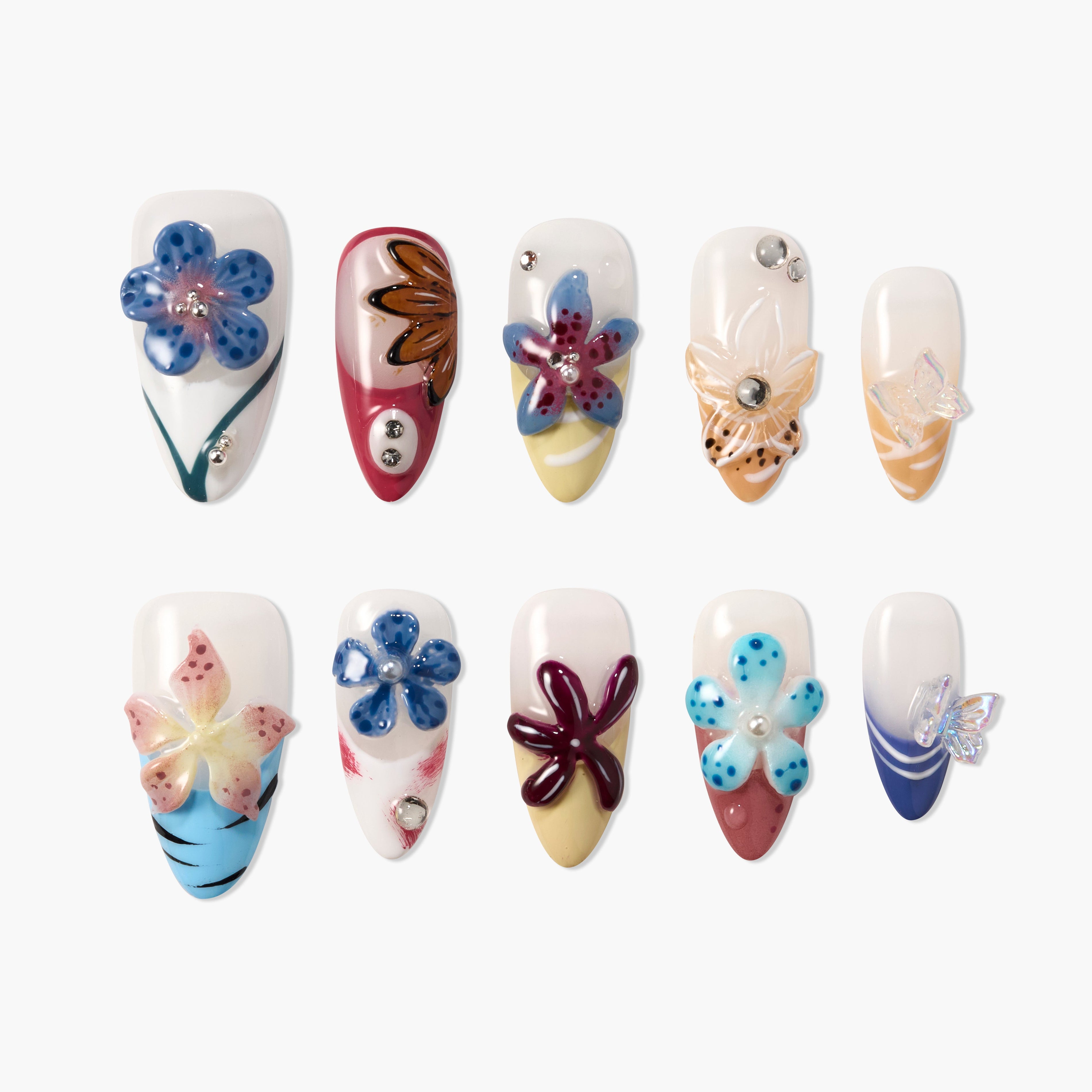 Handmade press-on nails with colorful 3D floral designs and rhinestone accents, white background.