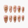 Cute bear-themed press-on nails with pink base, cartoon bear art, and playful accents.