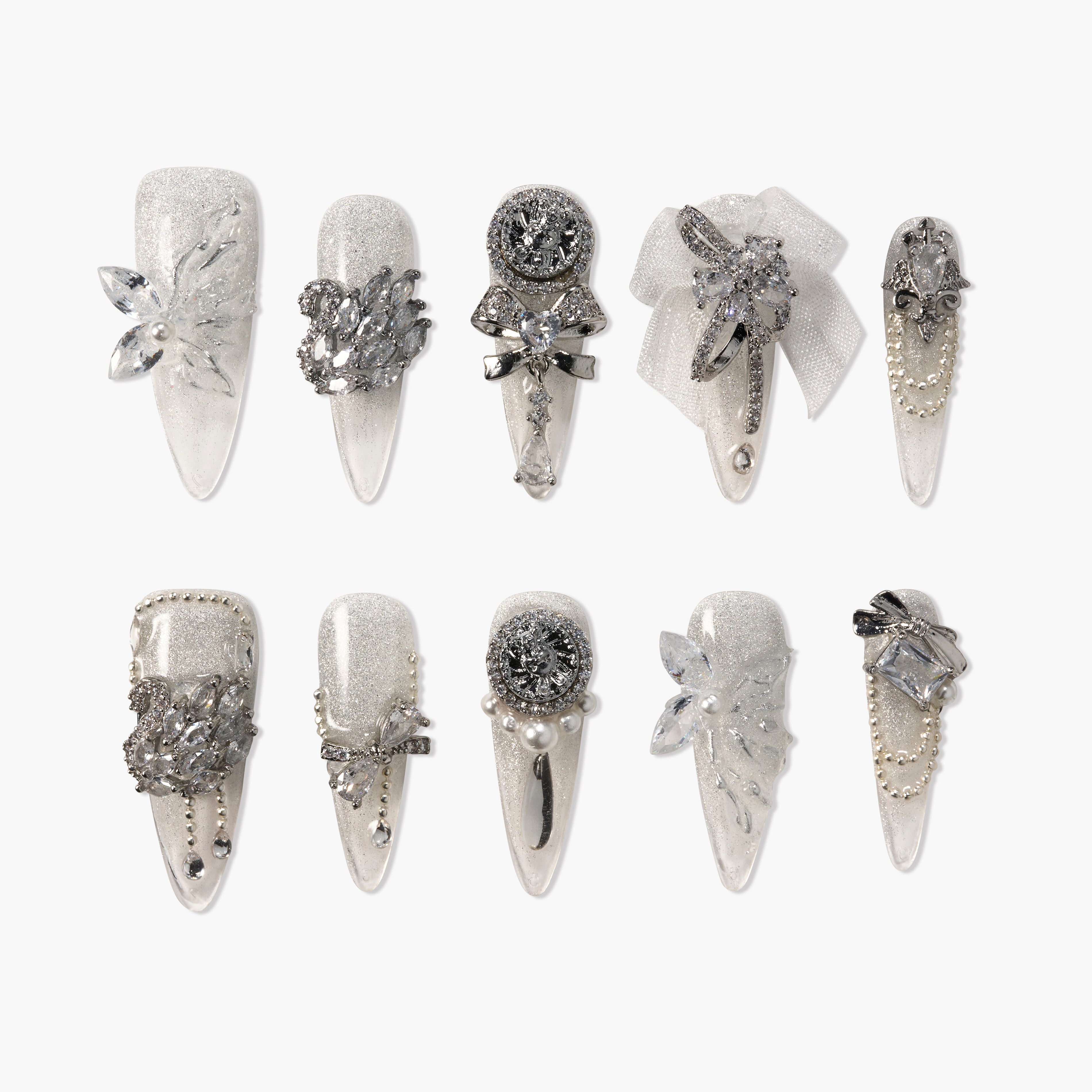 Silver glitter press-on nails with 3D rhinestones, pearls, bows, and floral accents