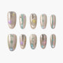 Handmade press-on nails with pastel star designs, metallic shimmer, and glitter accents