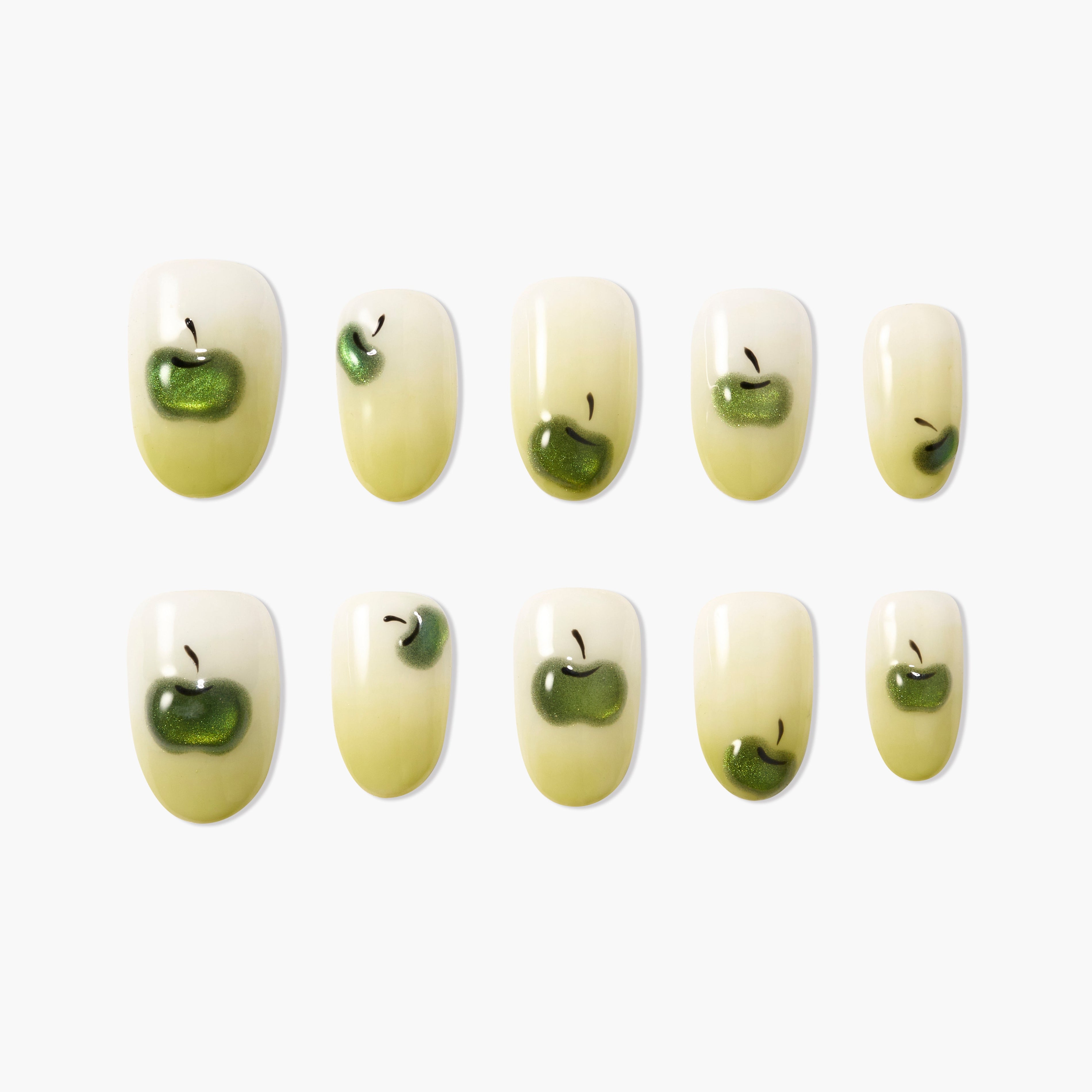 Green apple themed handmade press-on nails set, glossy finish, oval shape, on white background.