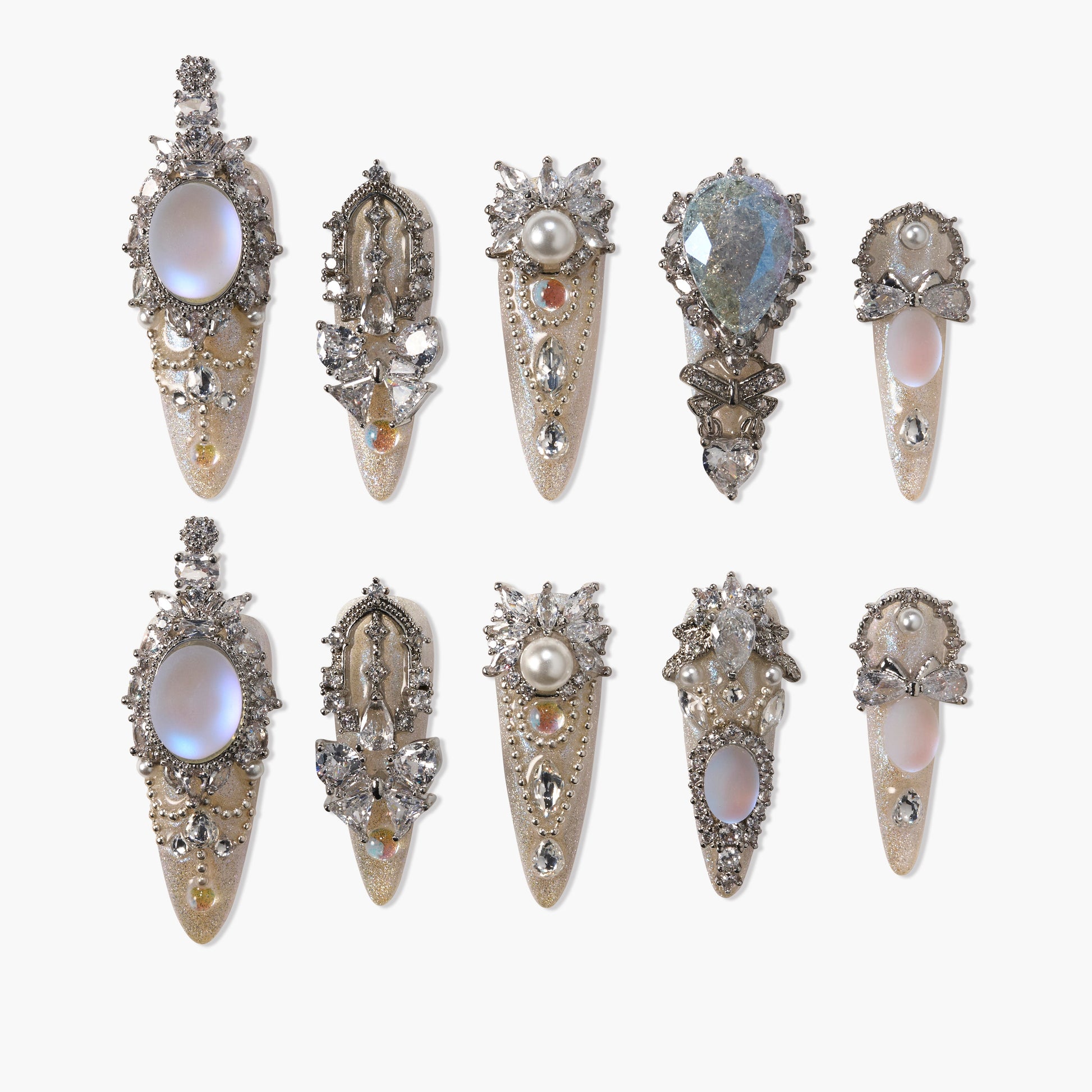 Handmade press-on nails set with pearl, opal, and rhinestone embellishments on a nude base