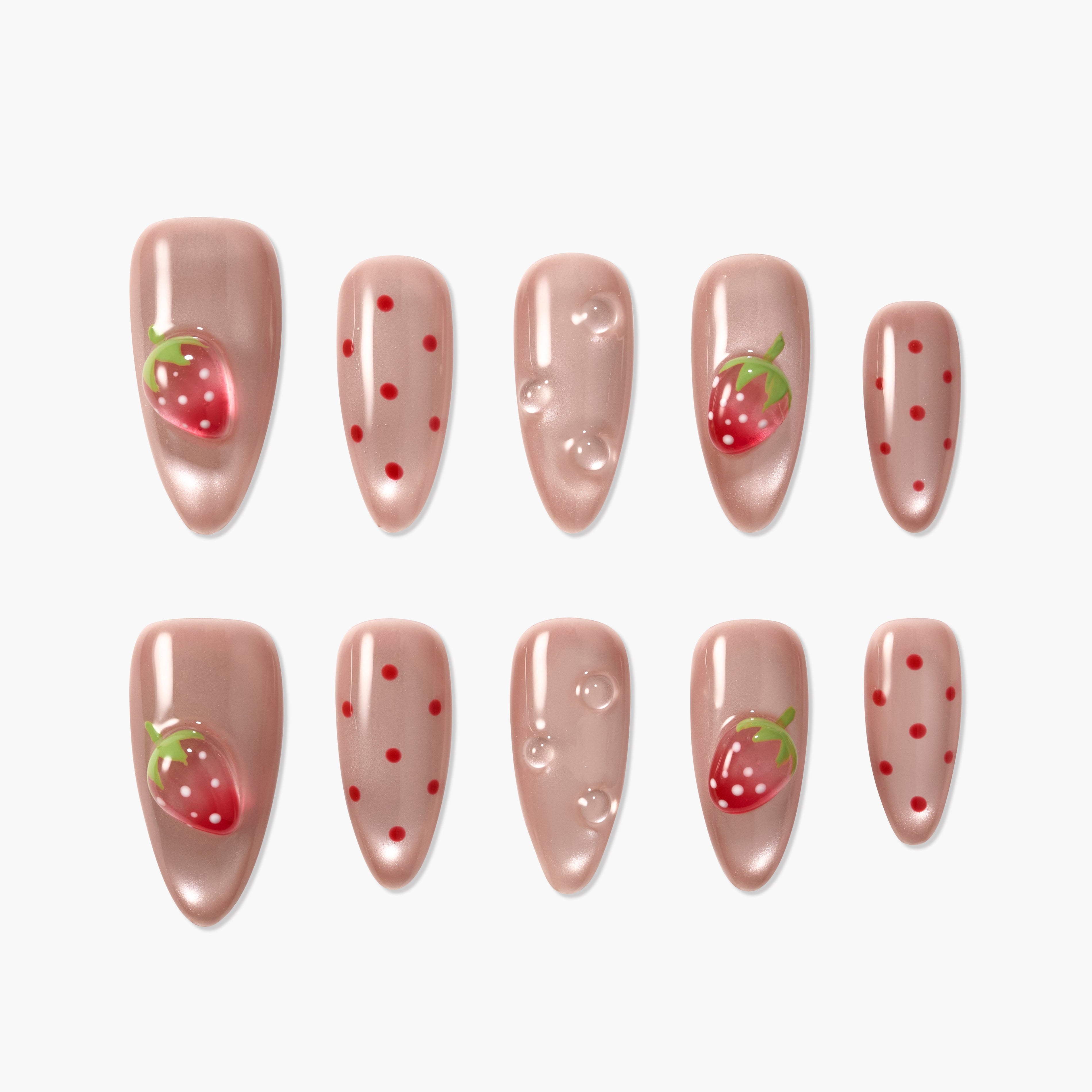 Glossy nude press-on nails with strawberry fruit designs, red dots, and bubble accents.