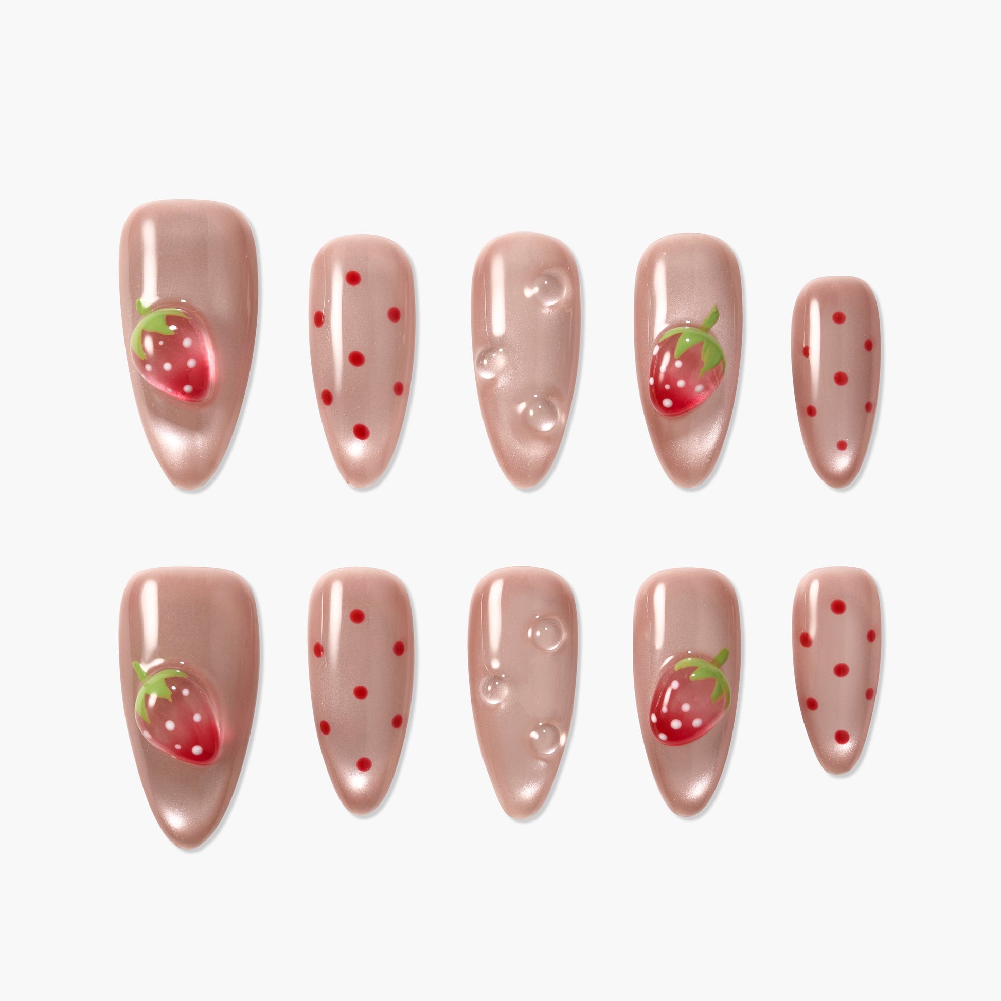 Glossy nude press-on nails with strawberry fruit designs, red dots, and bubble accents.