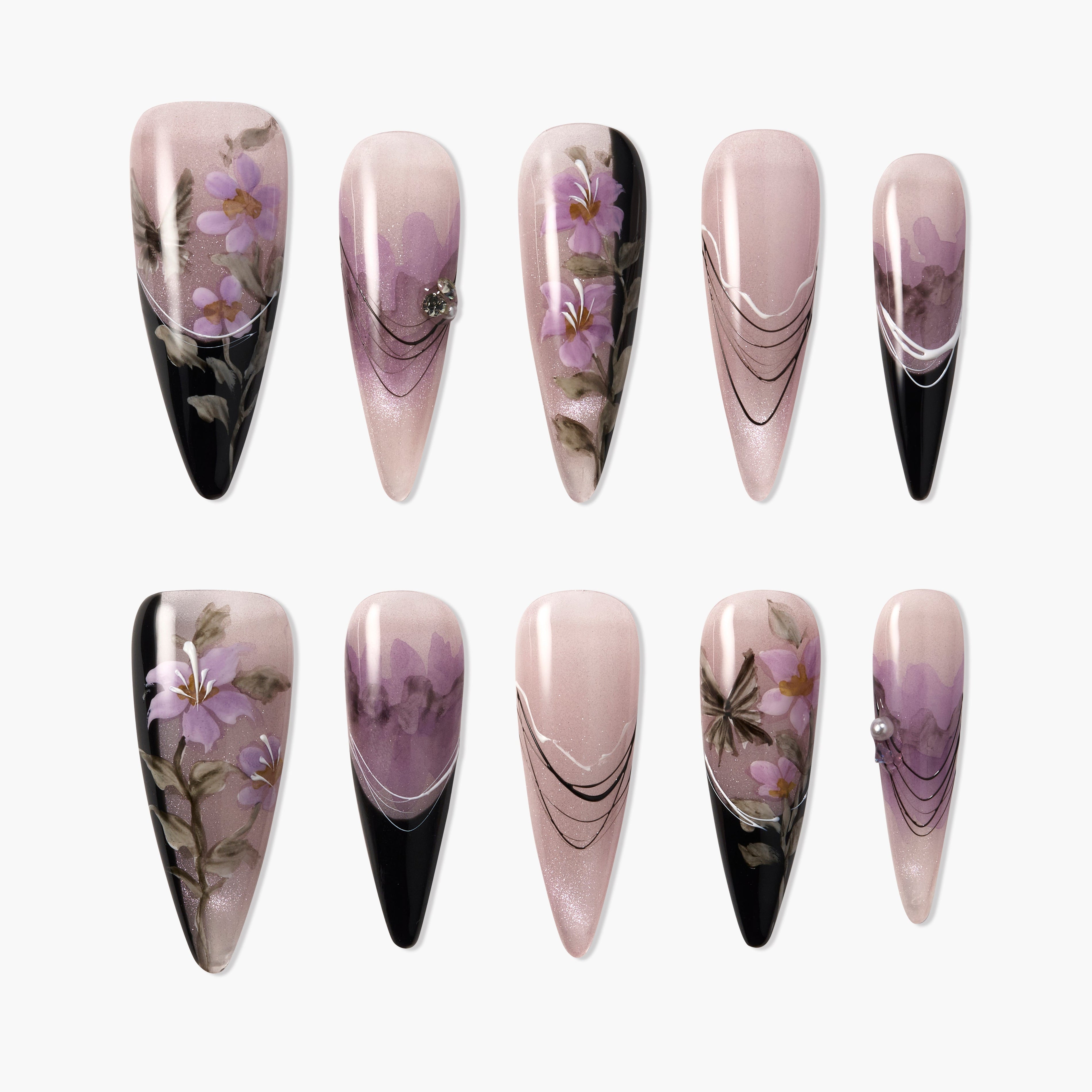 Handmade press-on nails with purple floral designs, black accents, and elegant lines