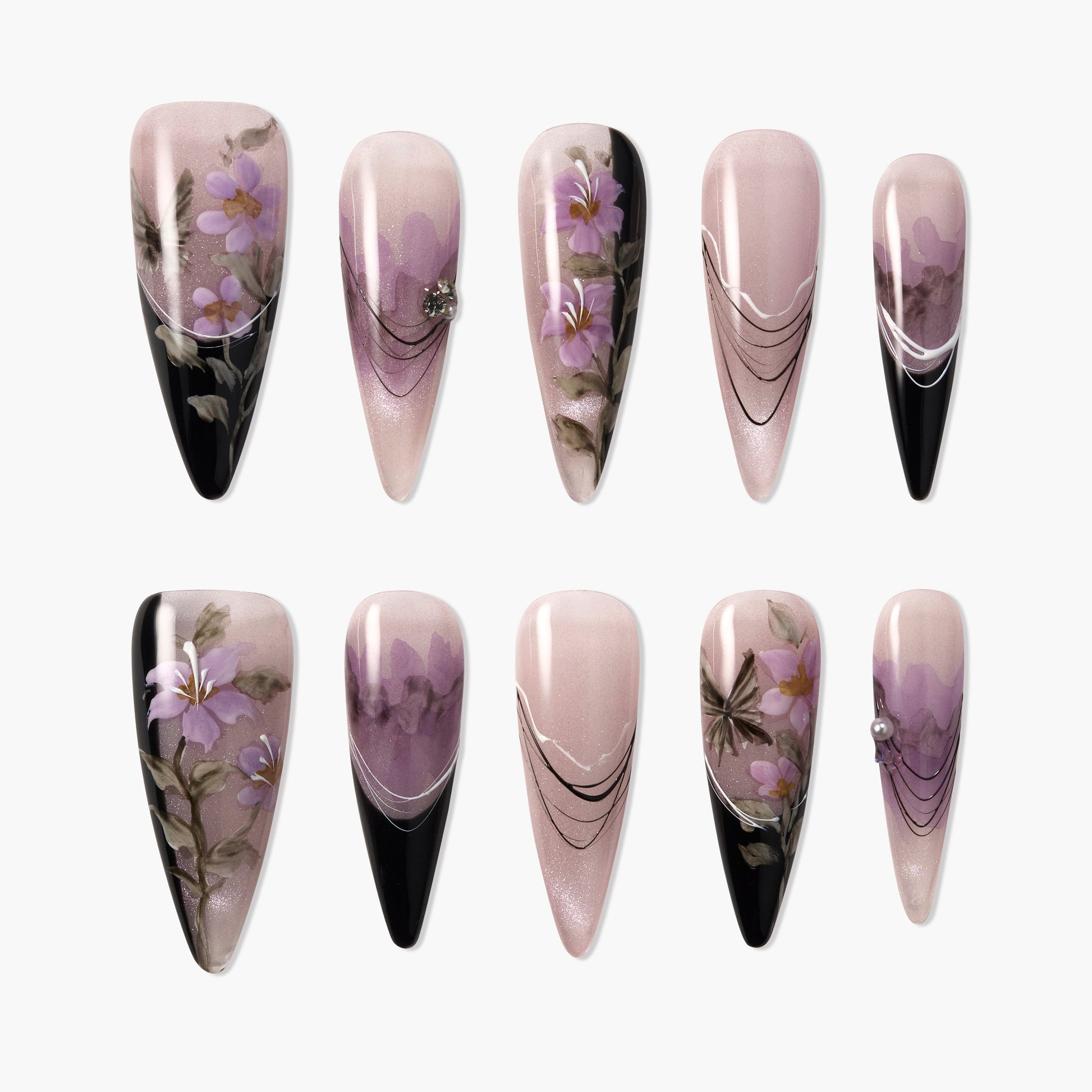 Handmade press-on nails with purple floral designs, black accents, and elegant lines