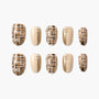 Handmade press-on nails with beige plaid, gold accents, and pearl embellishments