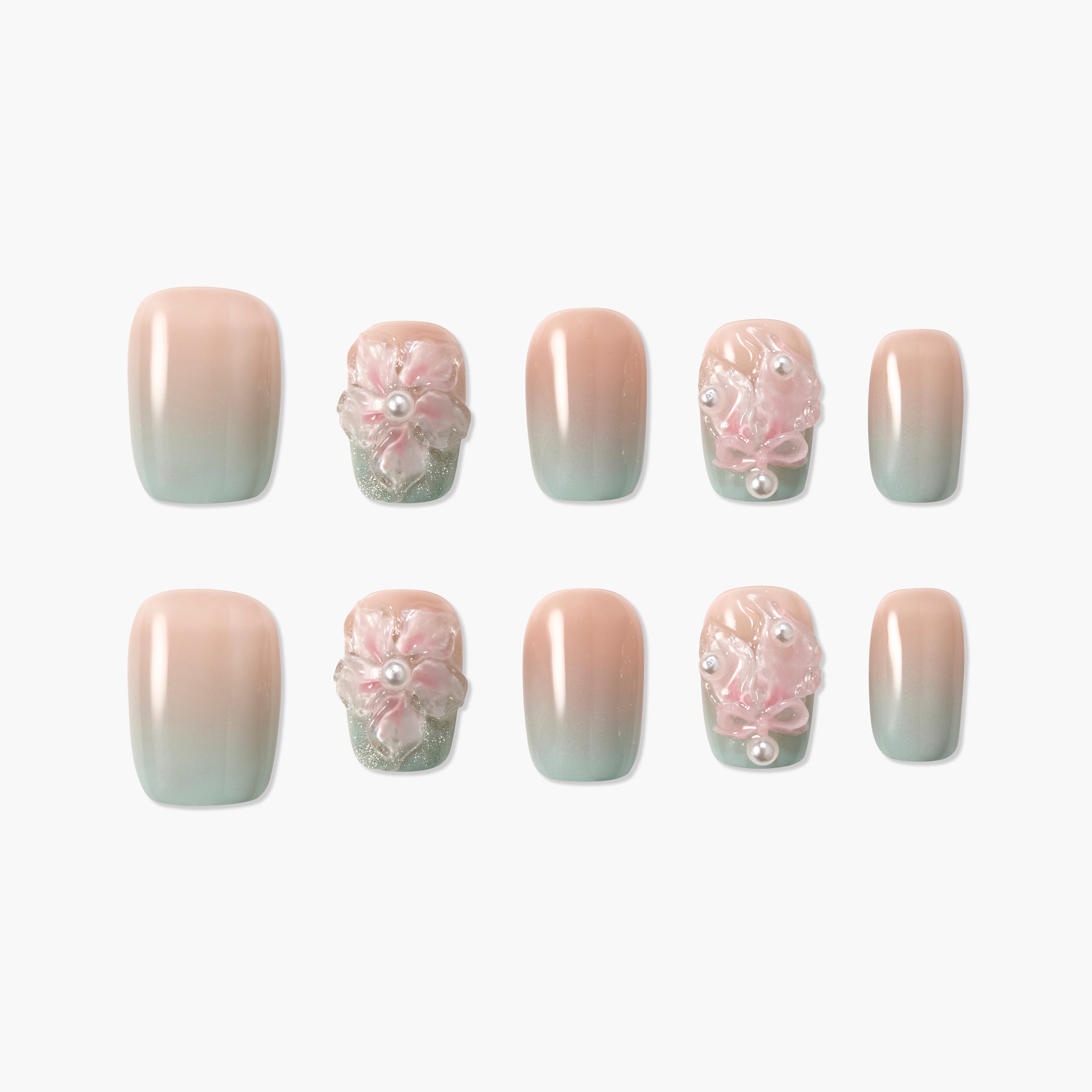 Handmade press-on nails with pink and green ombre, 3D floral and pearl accents