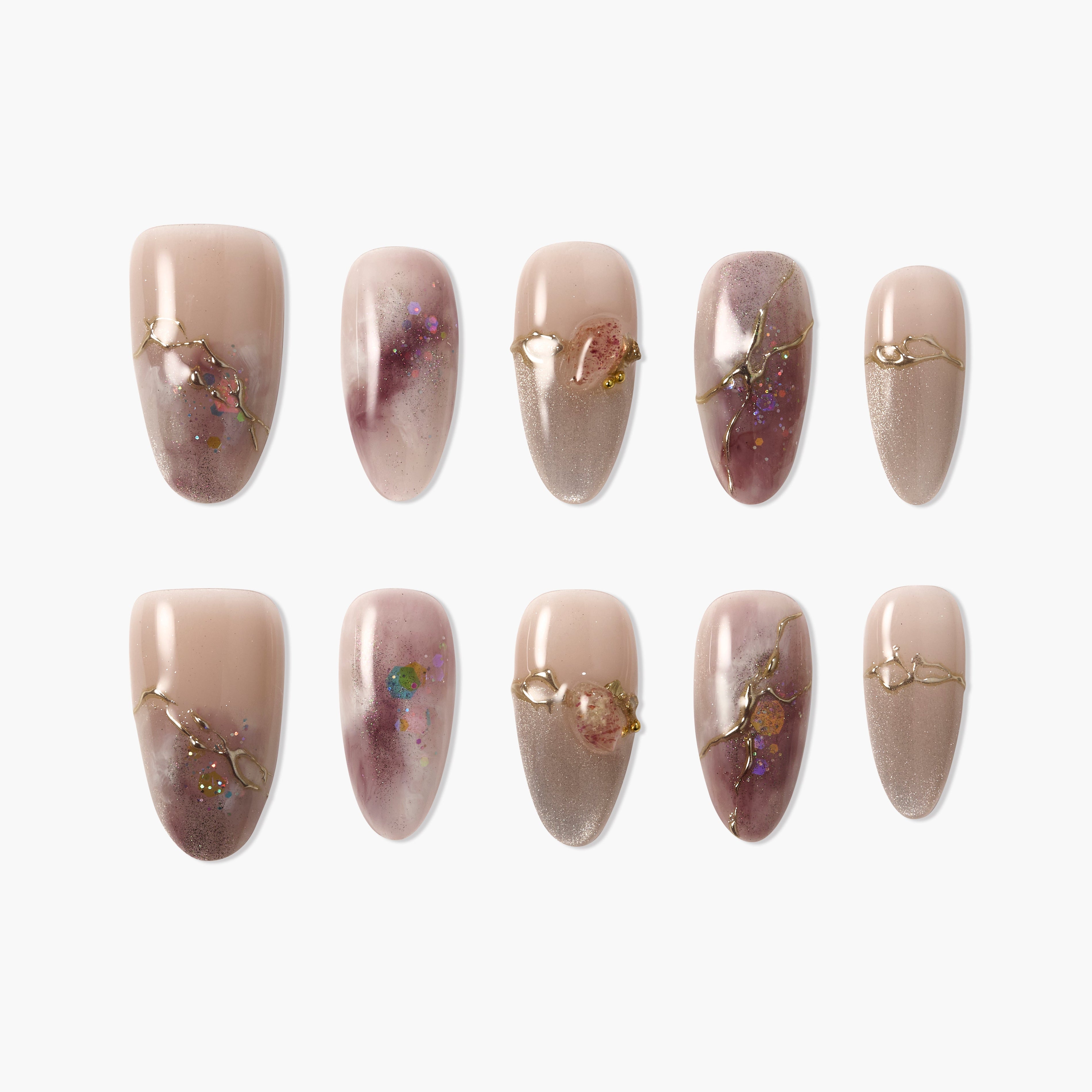 Handmade press-on nails with nude and marbled purple design, gold accents, and shimmer.