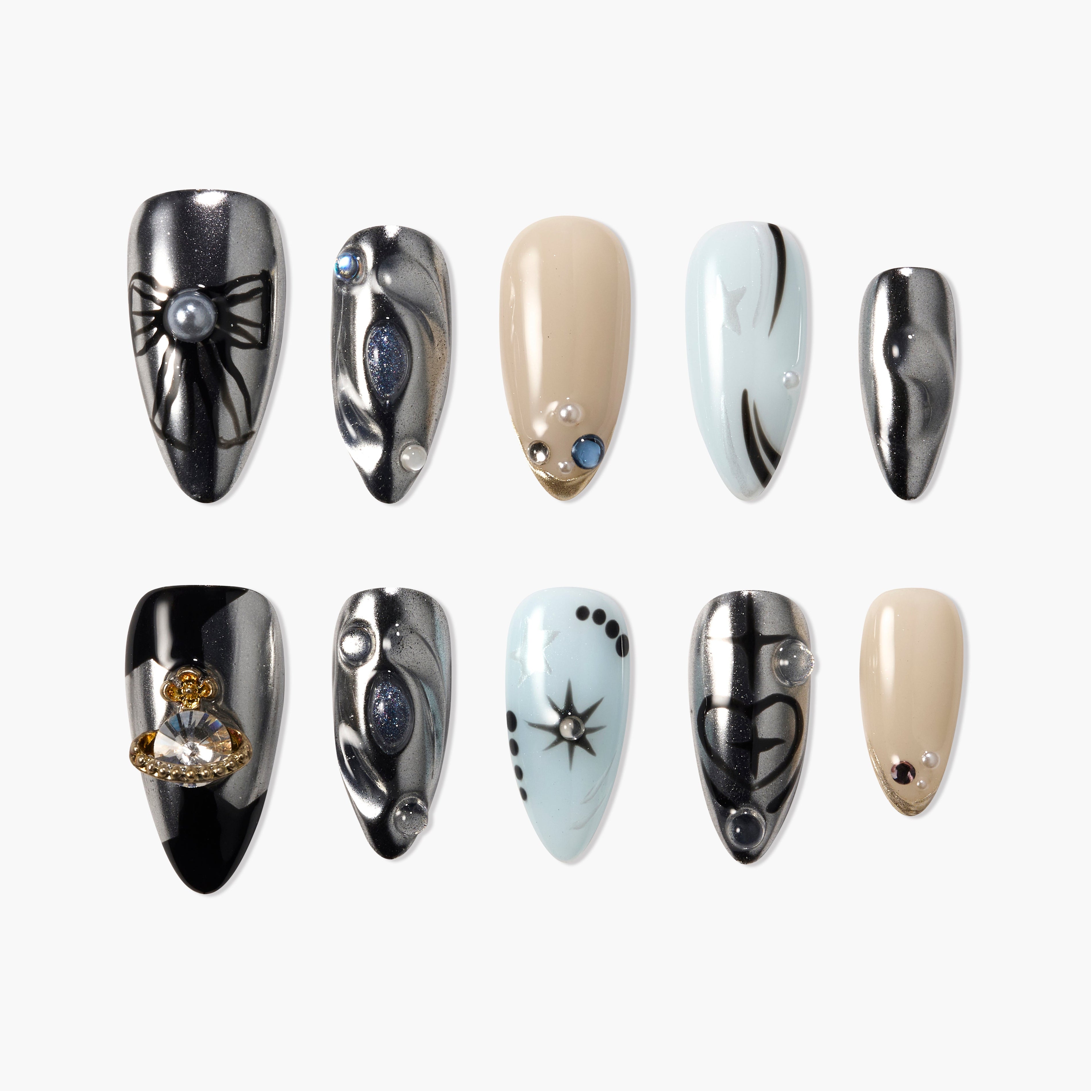Handmade press-on nails set with metallic, beige, and light blue designs, featuring 3D gems and celestial accents.