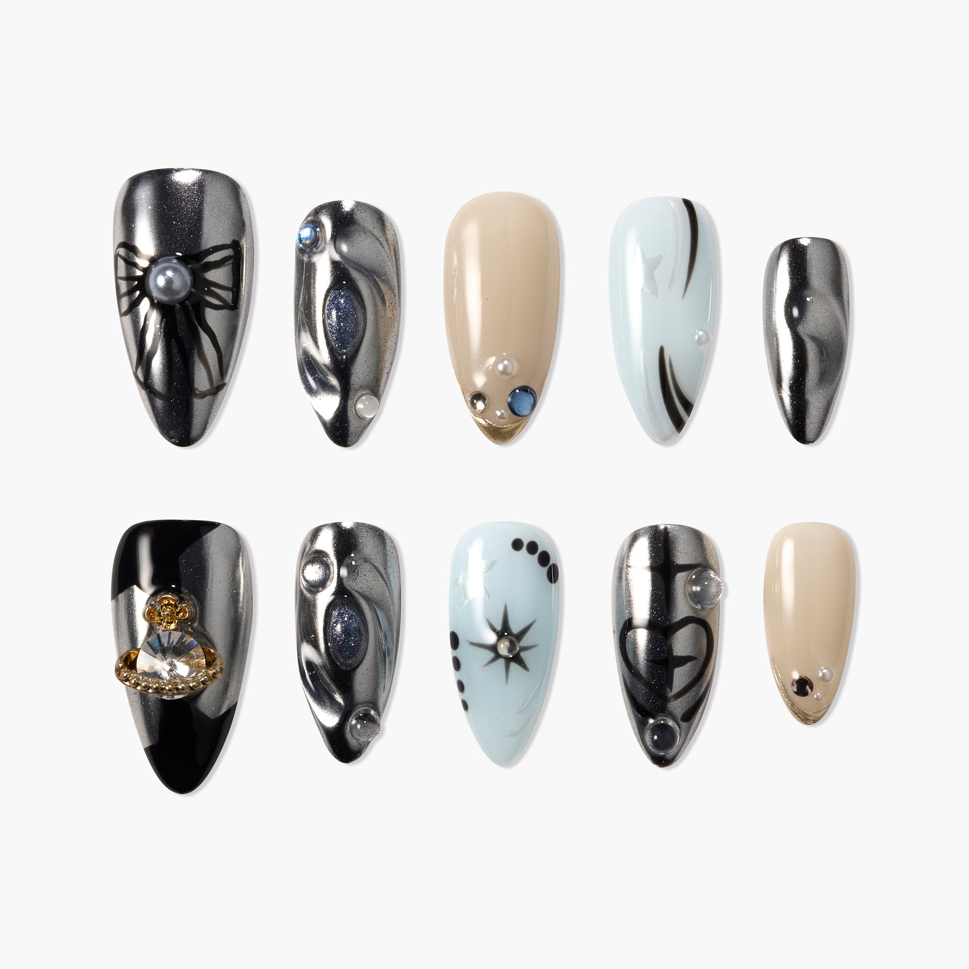 Handmade press-on nails set with metallic, beige, and light blue designs, featuring 3D gems and celestial accents.