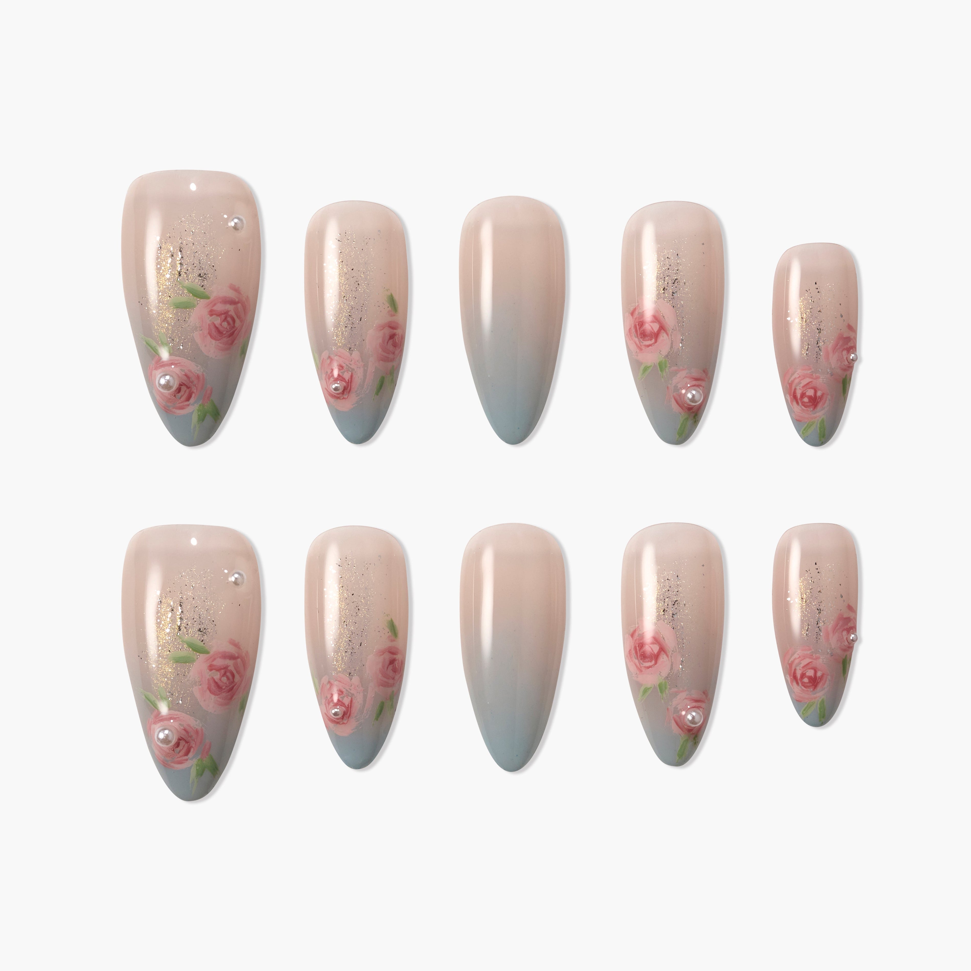 Handmade press-on nails with pink rose floral designs, pearls, and nude blue gradient tips