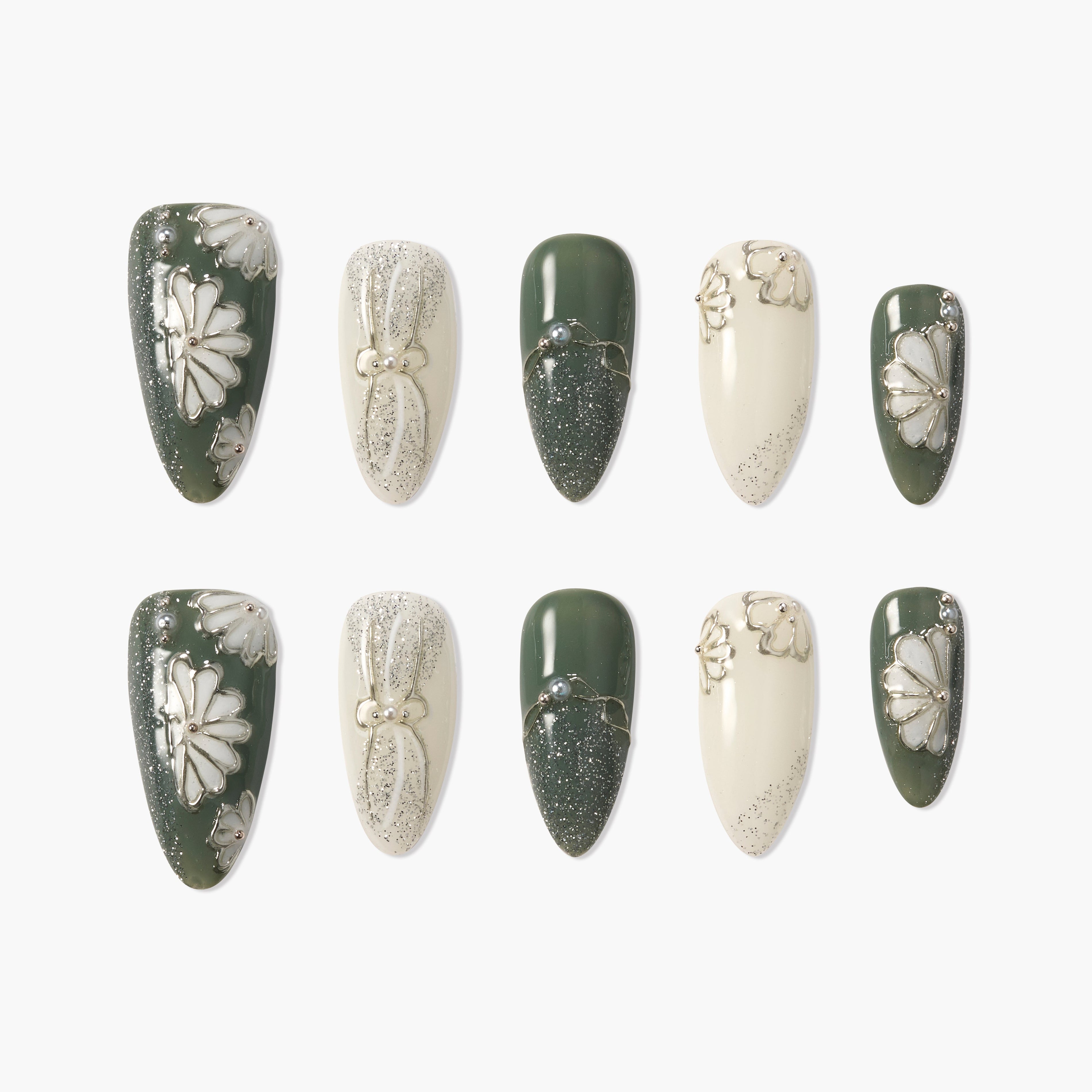 Handmade press-on nails in green and cream with daisy floral and glitter accents