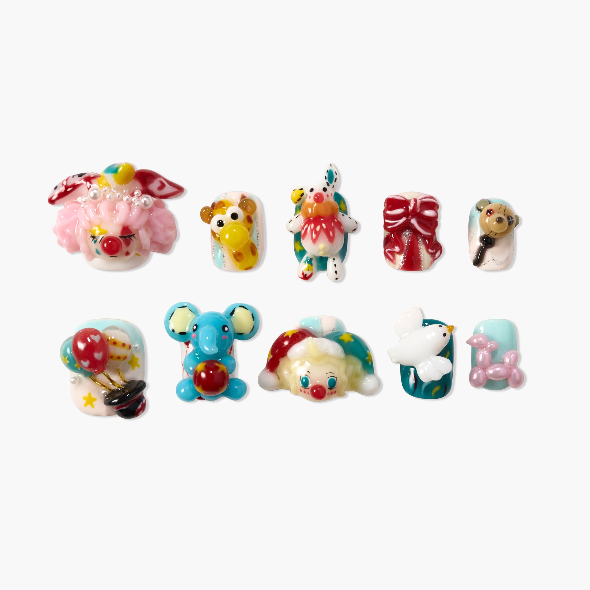 Handmade circus-themed press-on nails with 3D clown, animal, balloon, and bow designs on white background