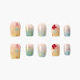 Handmade press-on nails with pastel bows, stars, and polka dots, glossy finish