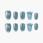 Blue glitter press-on nails with bow and ribbon accents, reusable handmade nail set