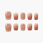 Peach design pink gradient press-on nails with glossy finish, arranged on white background