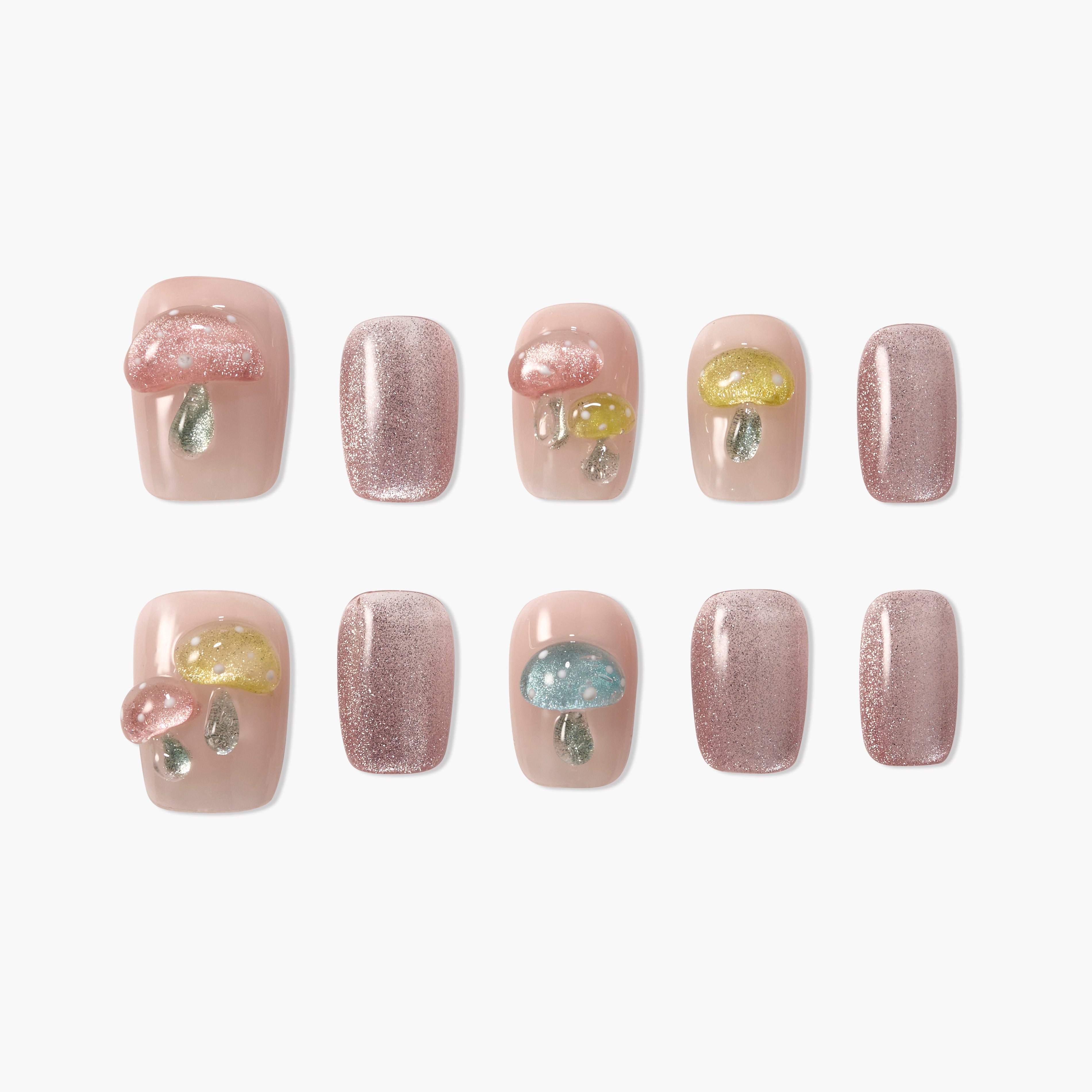 Set of handmade press-on nails with pastel mushroom designs and sparkly pink accents