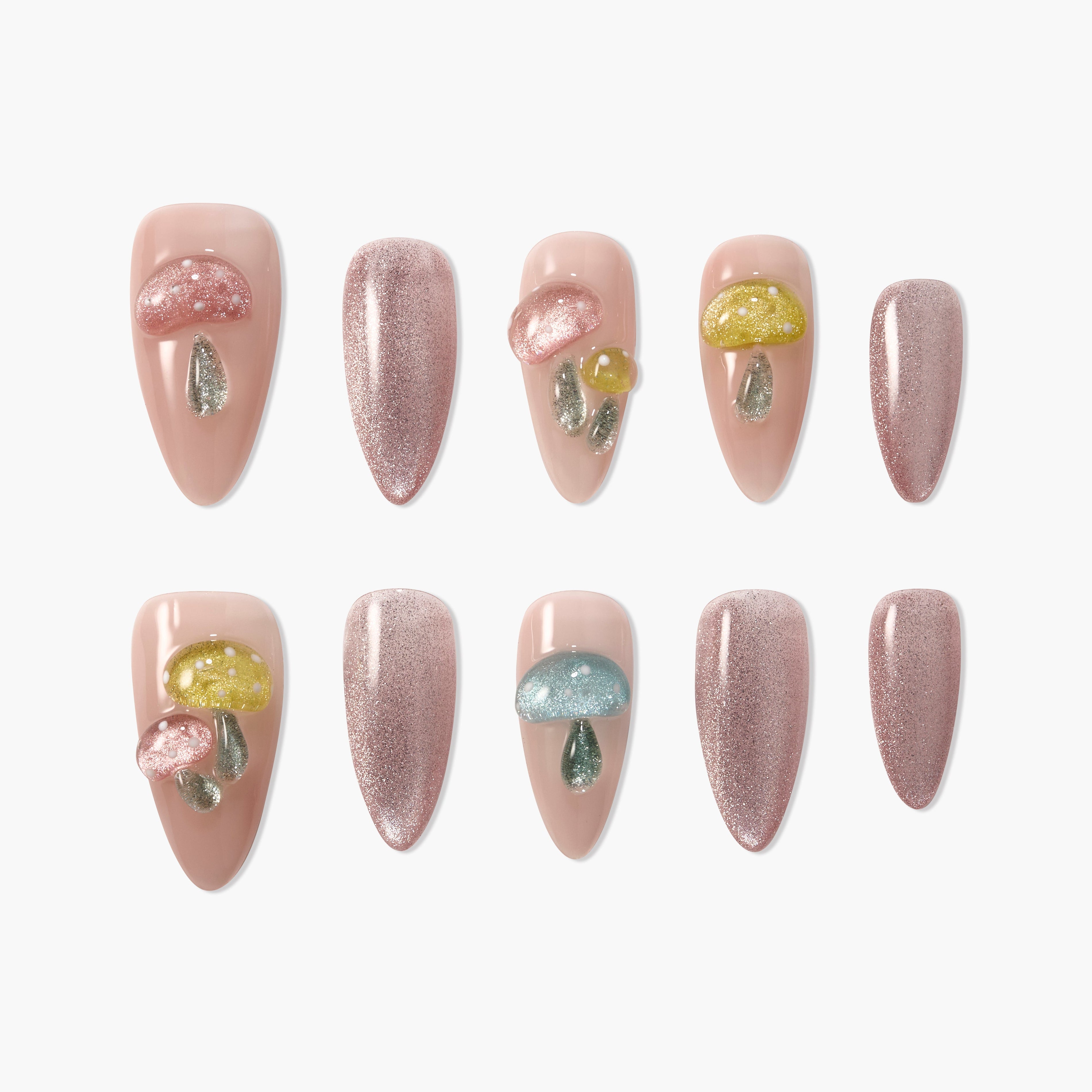 Handmade press-on nails with nude base, glitter accents, and 3D mushroom designs.