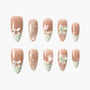 Cute pastel pink press-on nails with bows, polka dots, hearts, and 3D bunny designs.