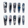 Handmade press-on nails with gothic castle, butterfly art, glitter, and 3D gemstone accents.
