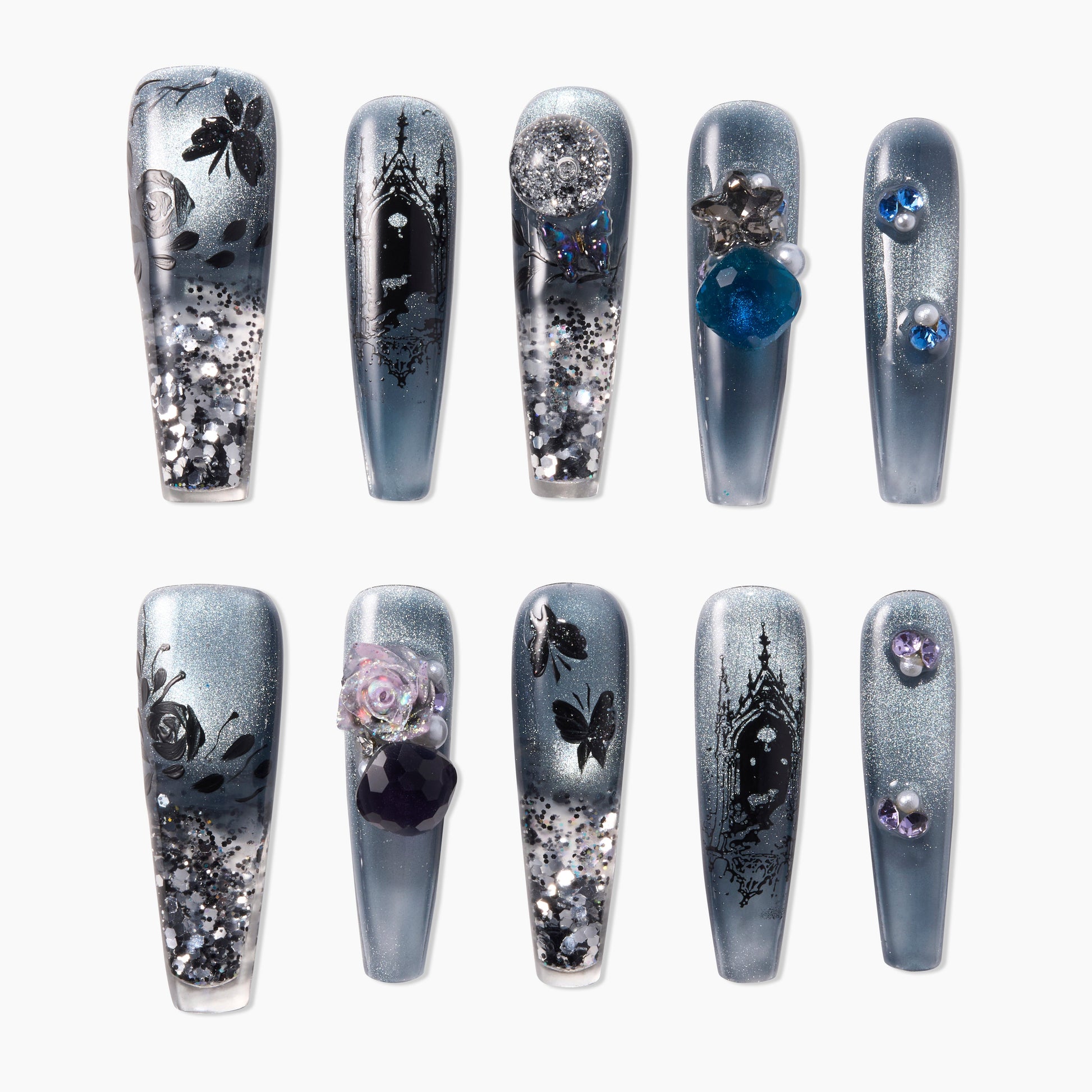 Handmade press-on nails with gothic castle, butterfly art, glitter, and 3D gemstone accents.