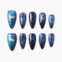 Galaxy-themed press-on nails with planets, stars, constellations, and plaid designs